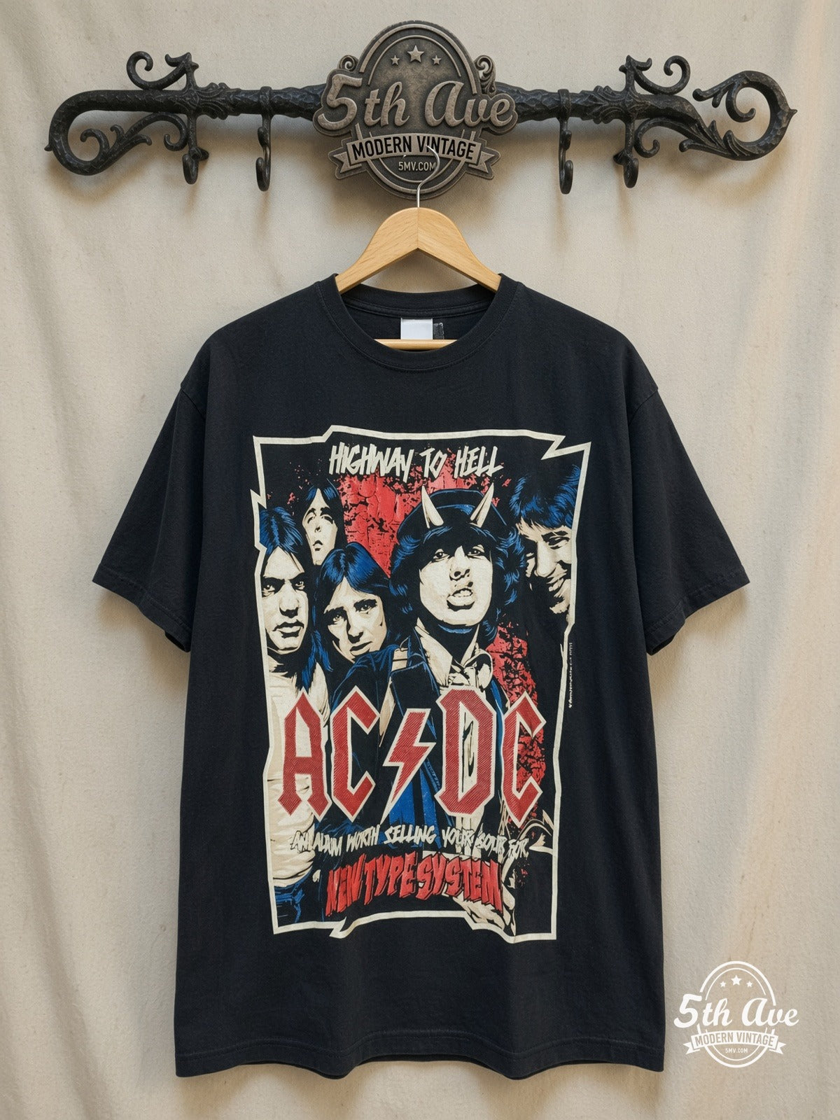 AC/DC – Highway to Hell New Type System Devil Horns – Vintage Band T-Shirt — front on locked cream ornate 5th Ave rack