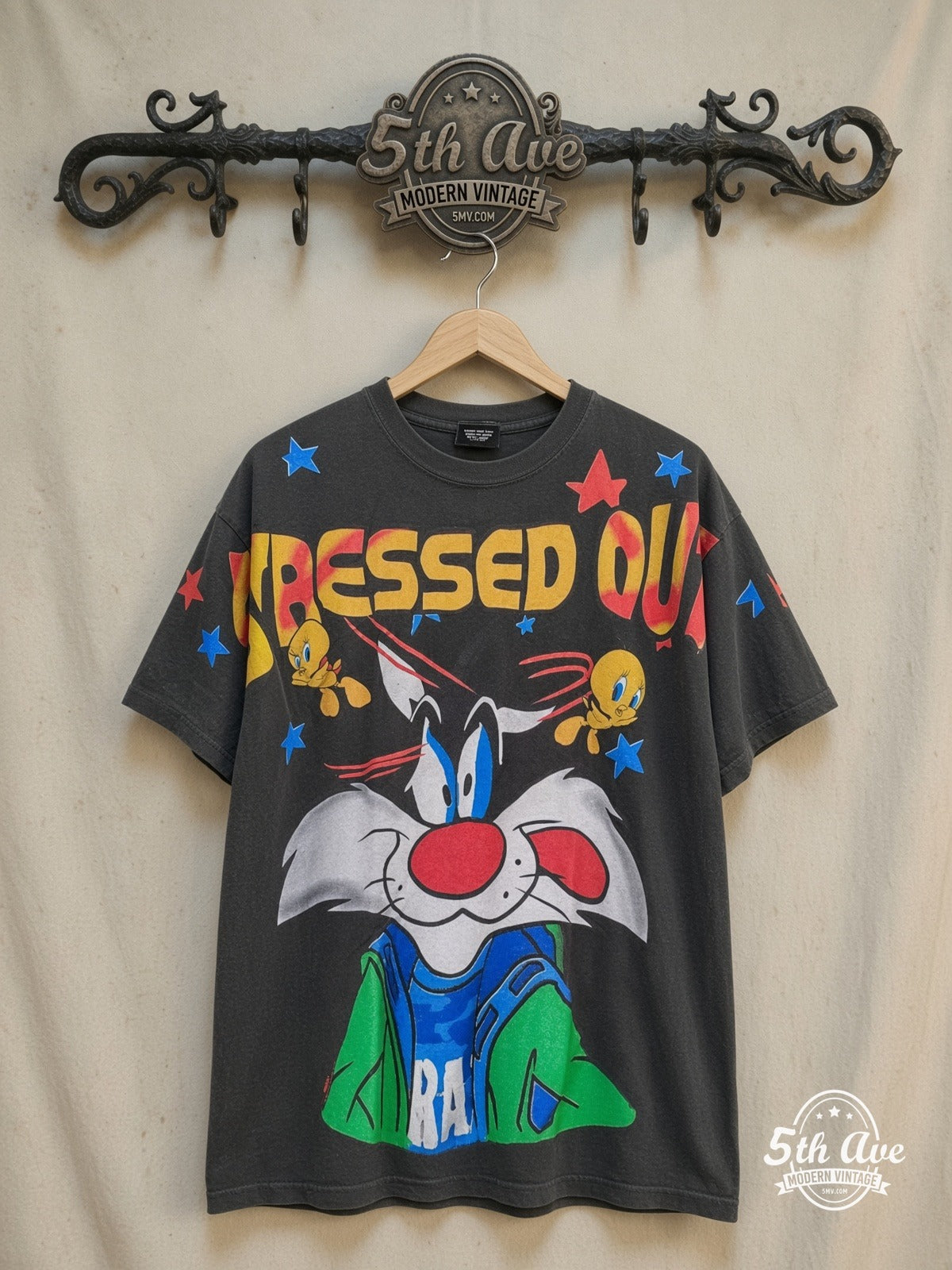 Looney Tunes – Sylvester and Tweety – All Over Print – New Vintage Graphic Tee — front on locked cream ornate 5th Ave rack