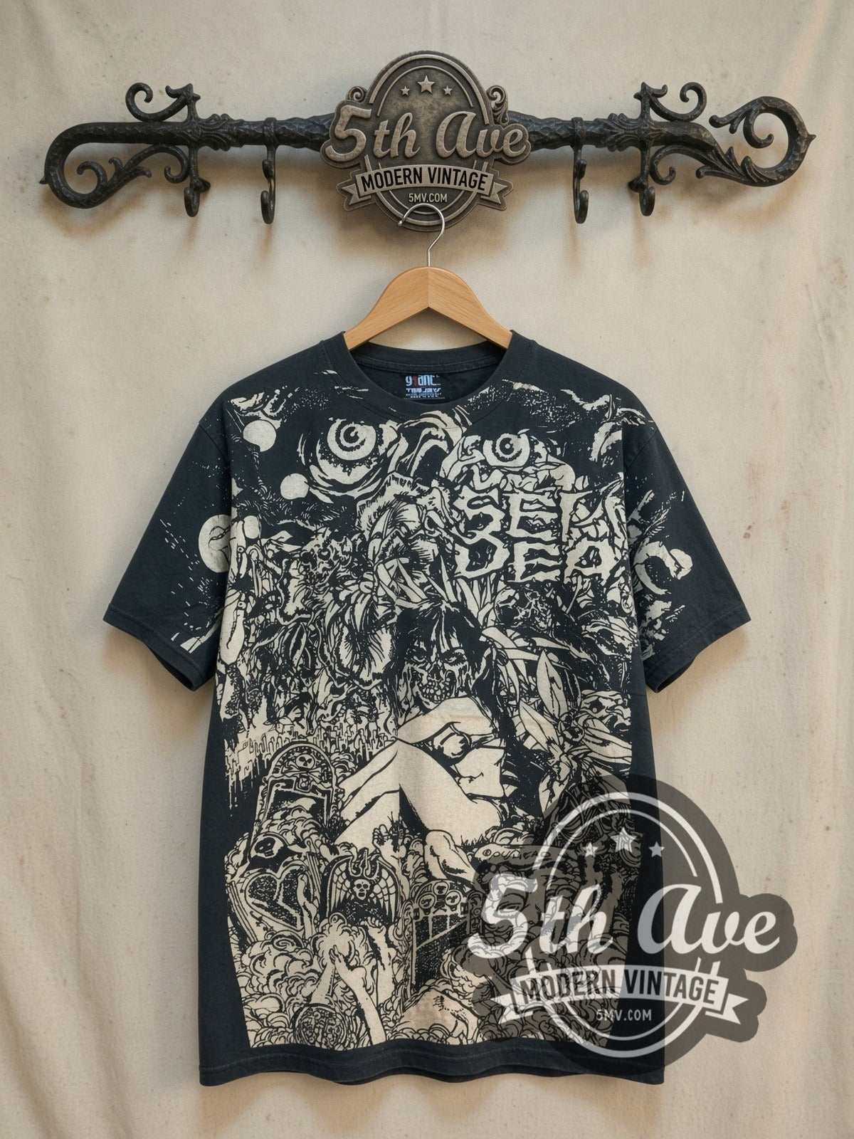 Septic Death Pushead Septic Death all-over-print vintage band t-shirt, front view on a display rack
