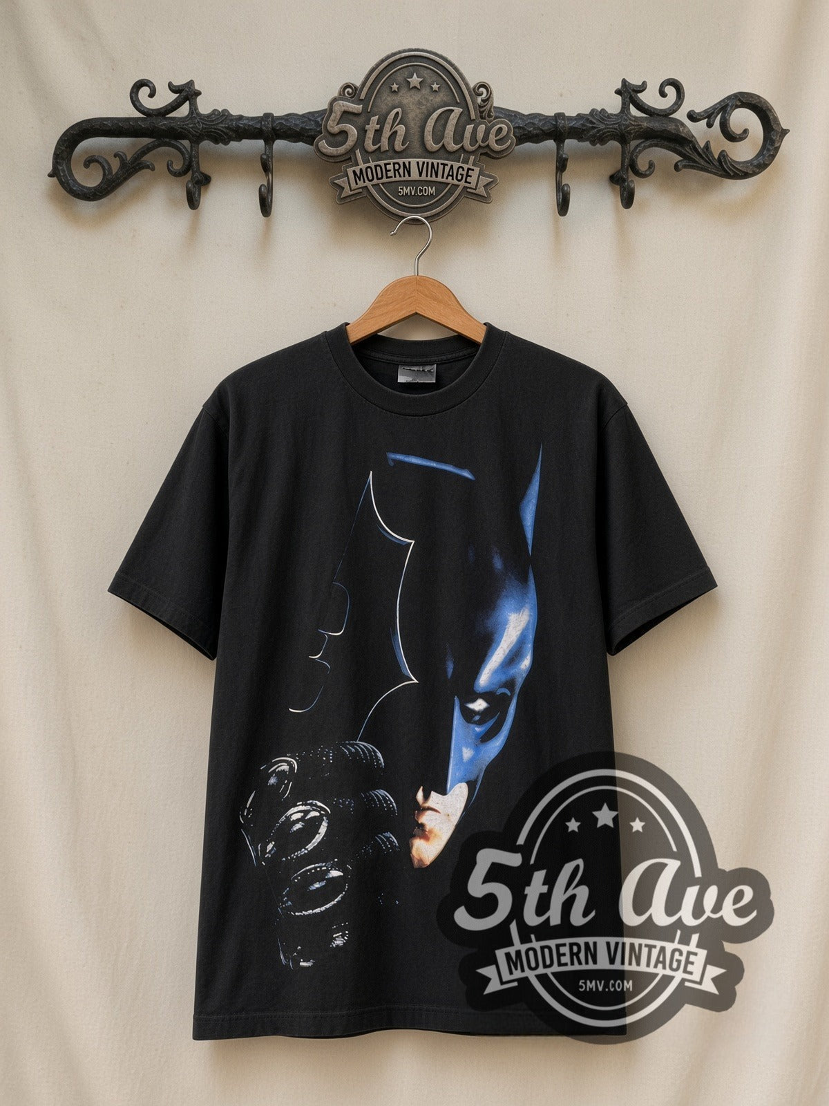 The Dark Knight Batman / Tumbler vintage graphic t-shirt, front view on a display rack