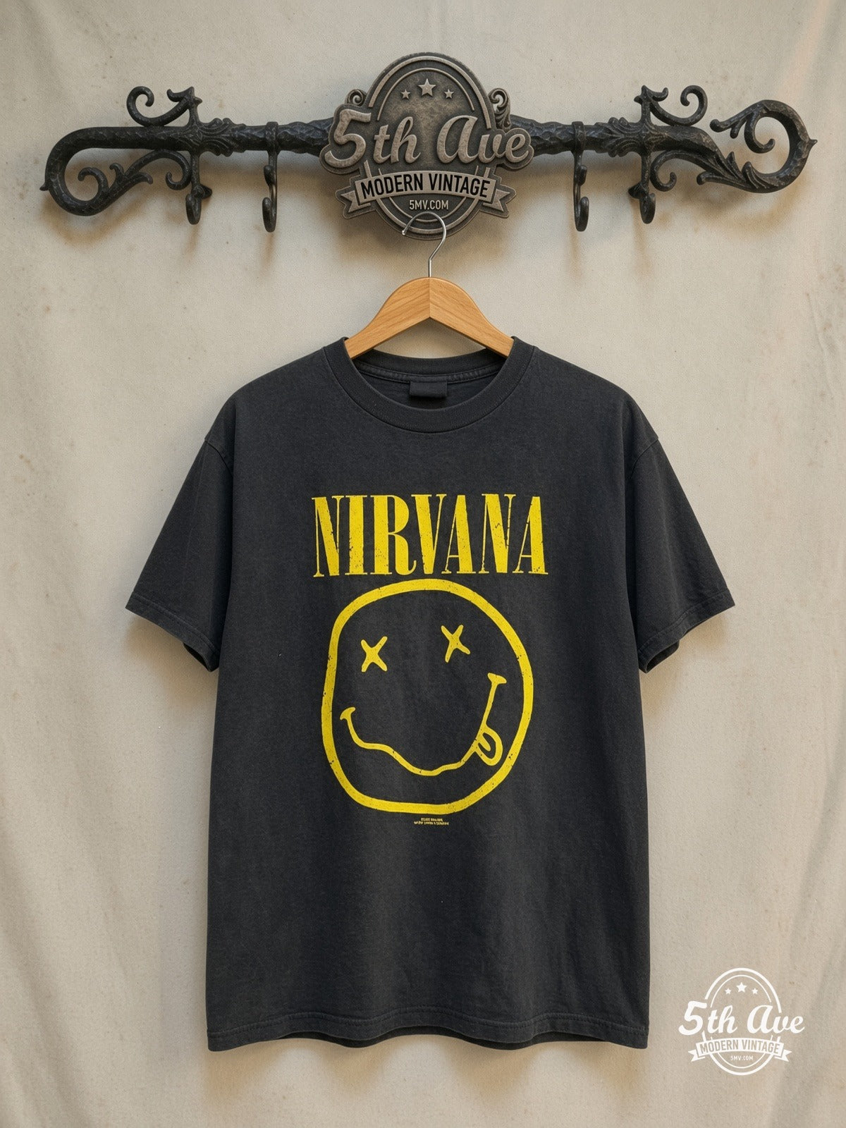 Nirvana – Smiley Face Corporate Rock Whores – Vintage Band T-Shirt — front on locked cream ornate 5th Ave rack