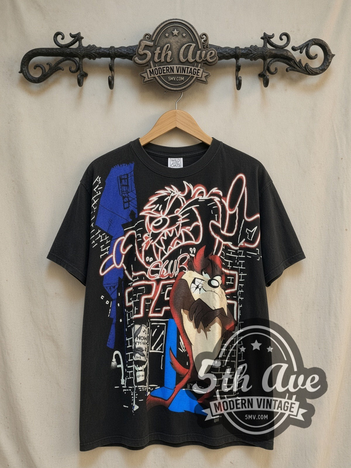 Looney Tunes Taz Mania Retro all-over-print vintage cartoon tee, front view on a display rack