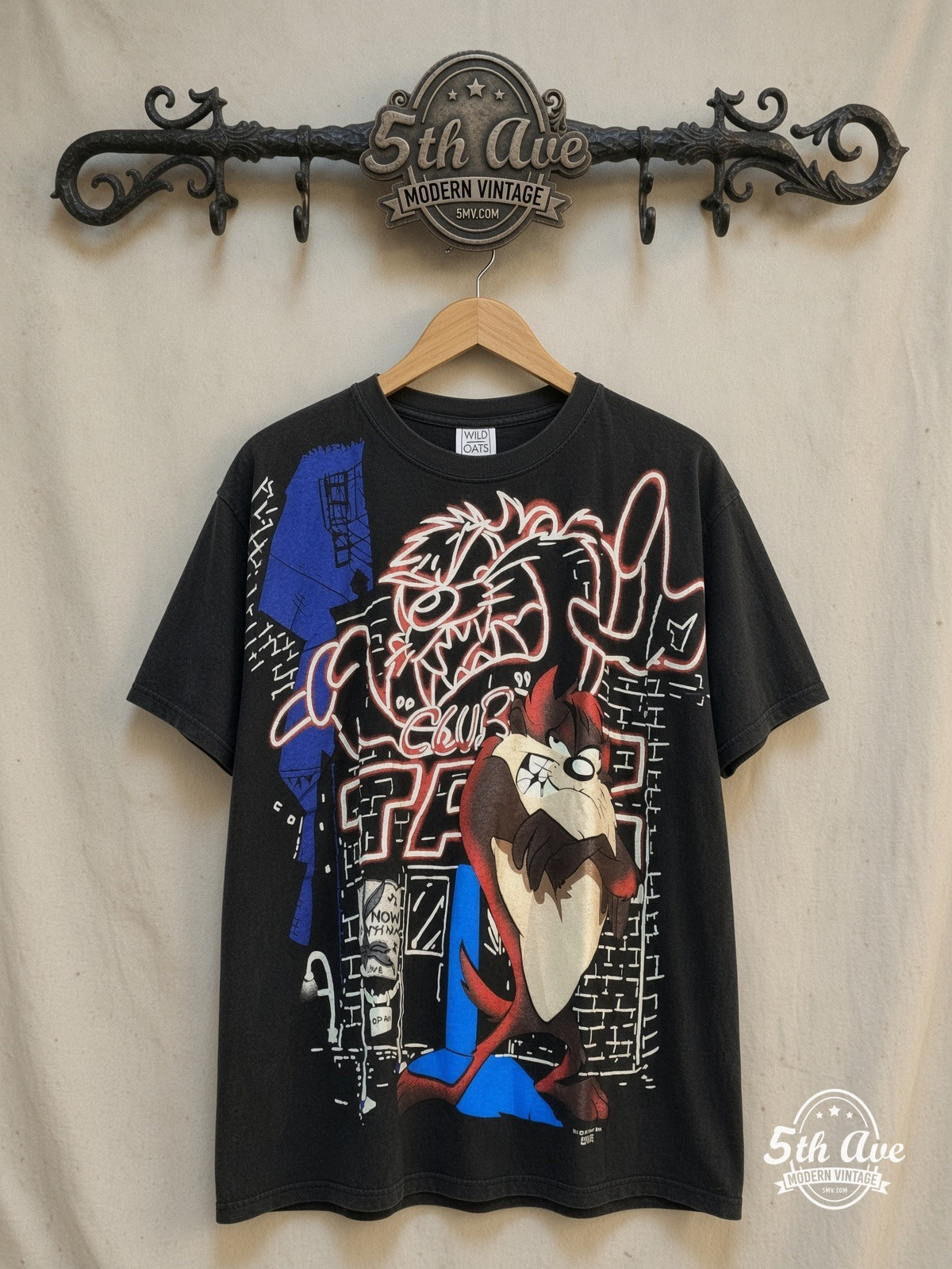 Looney Tunes – Taz Mania Retro AOP Graphic Classic T-Shirt – New Vintage Graphic Tee — front on locked cream ornate 5th Ave rack