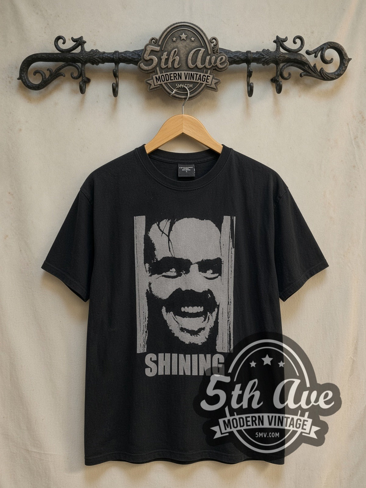 The Shining Jack Torrance vintage movie t-shirt, front view on a display rack