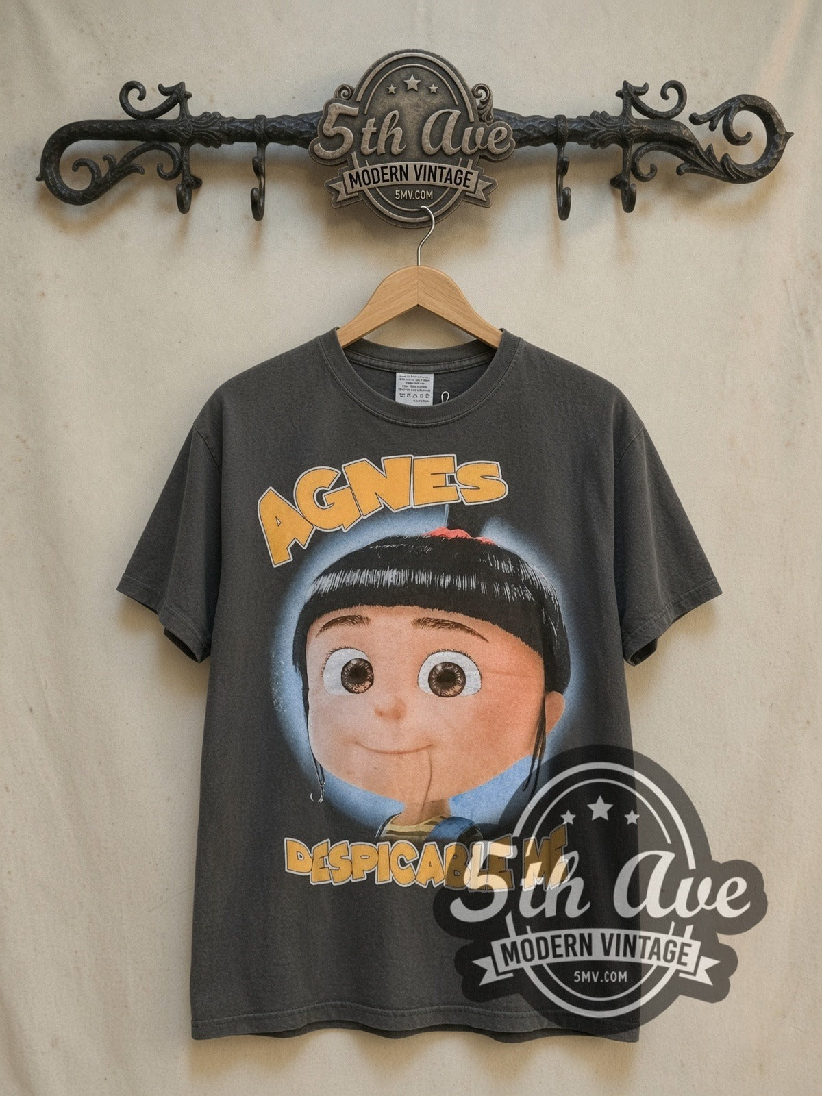 Despicable Me Agnes and Her Unicorn Adventure vintage cartoon tee, front view on a display rack