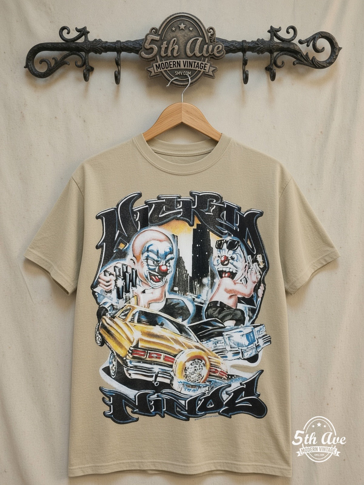 Rollin Hard Lowrider Clowns graphic tee, front view on a display rack