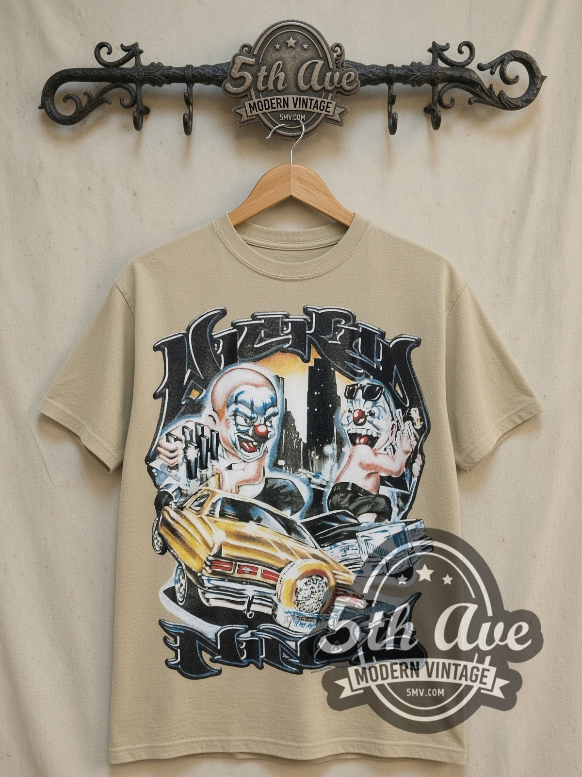 Rollin Hard Lowrider Clowns vintage graphic tee, front view on a display rack
