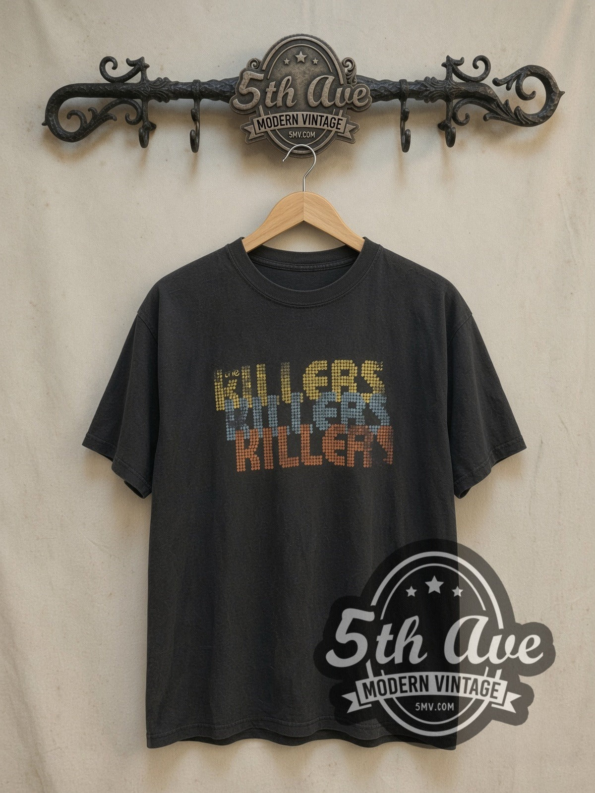 The Killers Retro Pixel Art Killers vintage band t-shirt, front view on a display rack