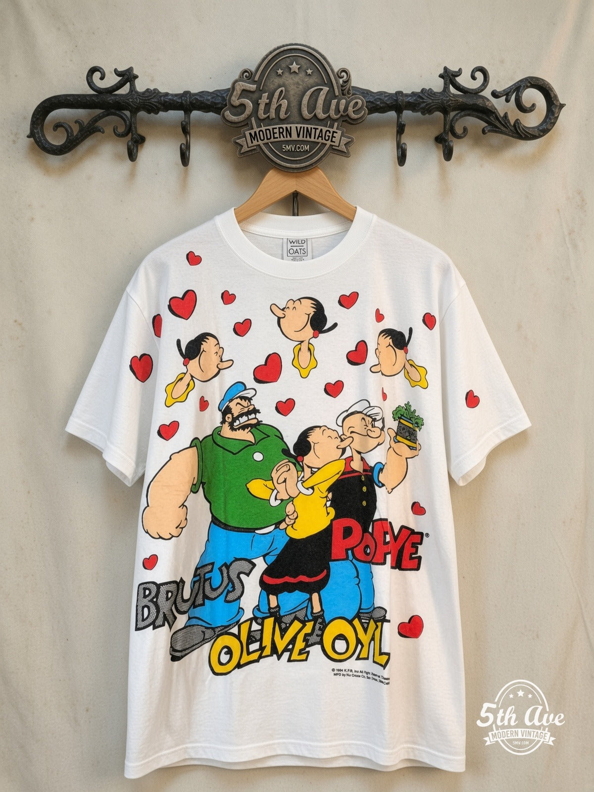 Popeye the Sailor Man – All Over Print – New Vintage Graphic Tee — front on locked cream ornate 5th Ave rack