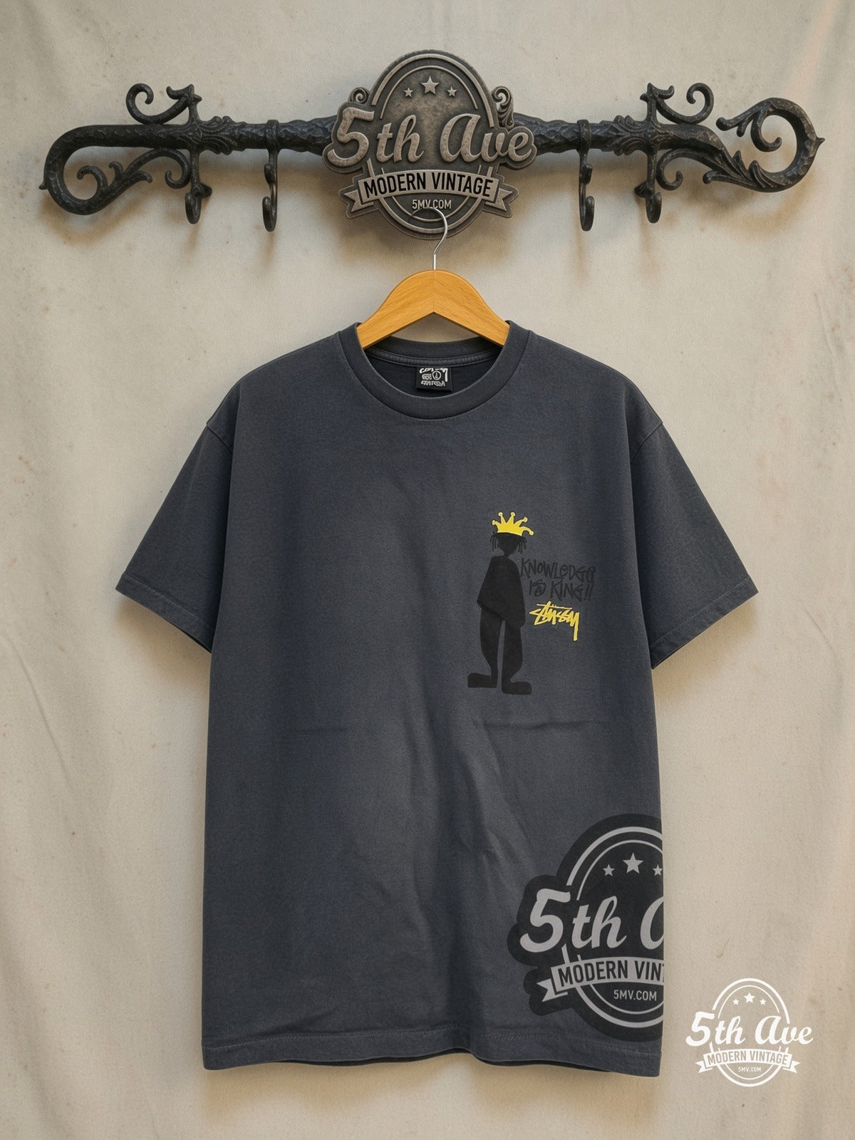 Stussy – Knowledge Is King – Vintage Graphic Tee — front on locked cream ornate 5th Ave rack