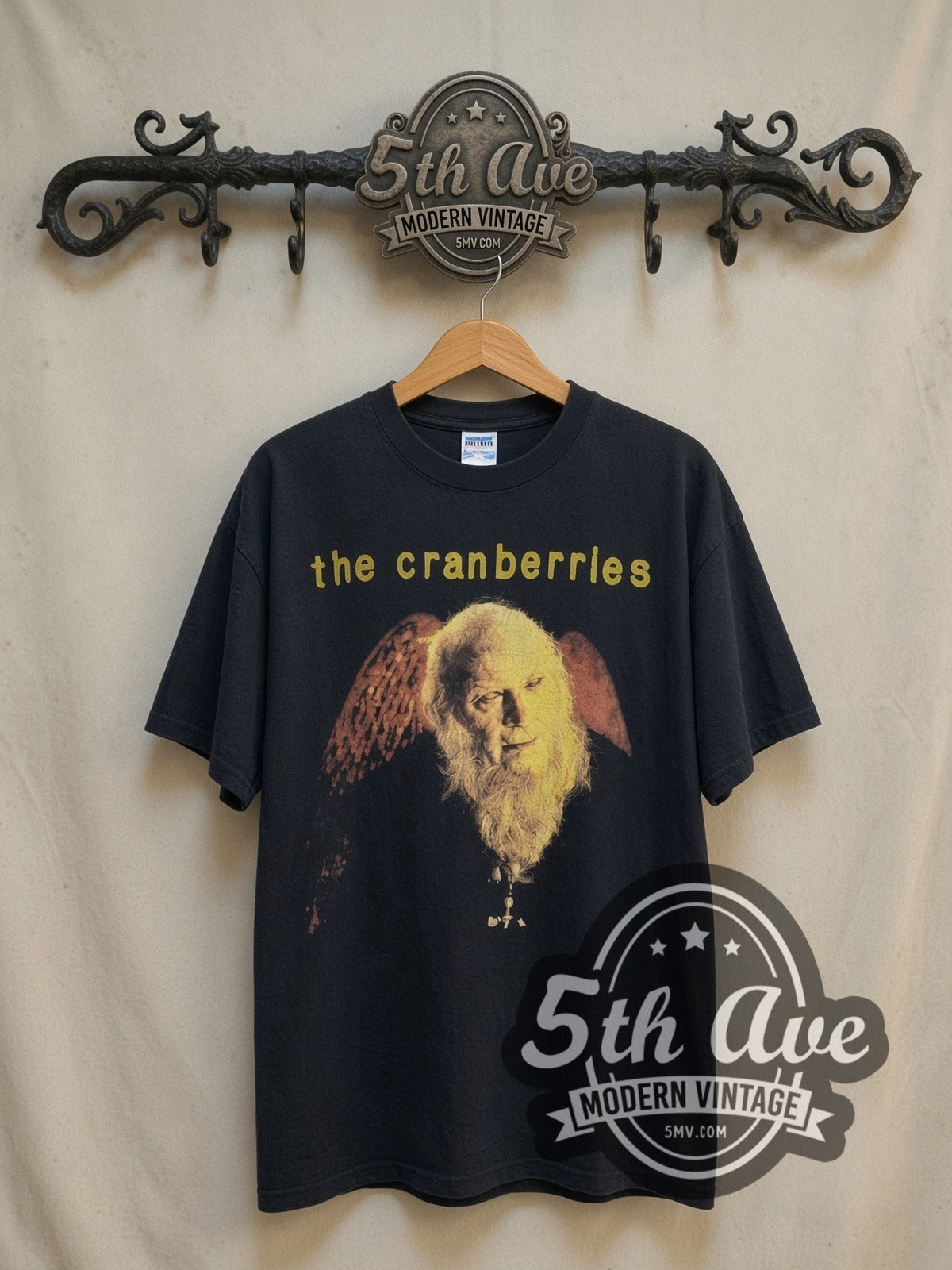 The Cranberries No Need to Argue World Tour 95 vintage band t-shirt, front view on a display rack