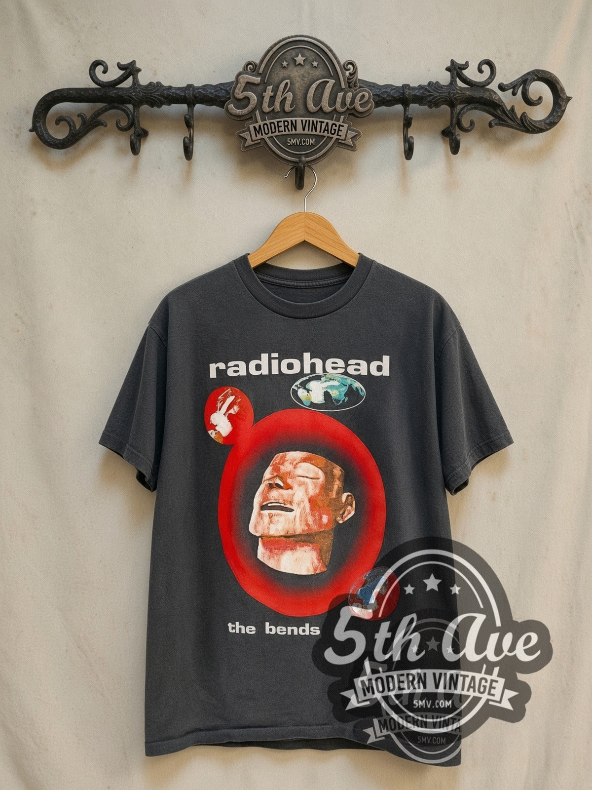 Radiohead The Bends Mannequin Head Globes UK Tour vintage band t-shirt in black, front view on a display rack