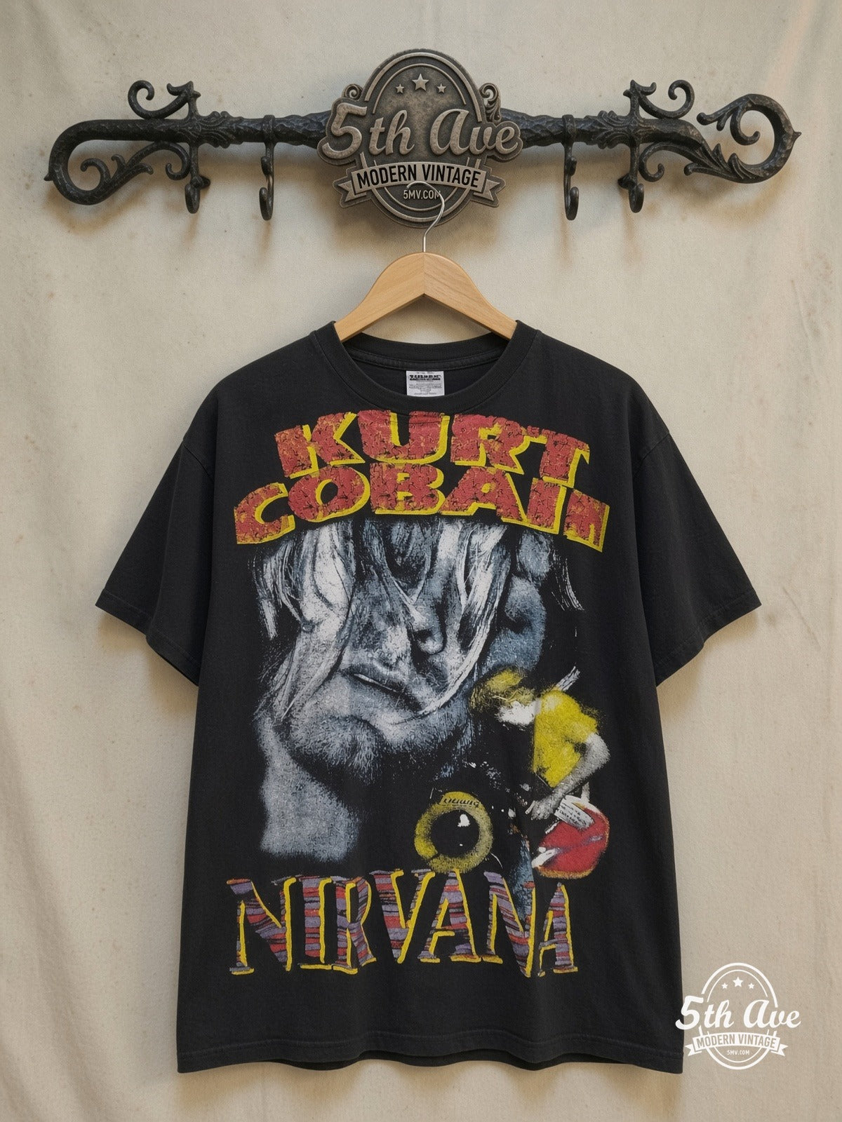 Nirvana – Nirvana T-Shirt Iconic Rock Band Graphic – Vintage Band T-Shirt — front on locked cream ornate 5th Ave rack