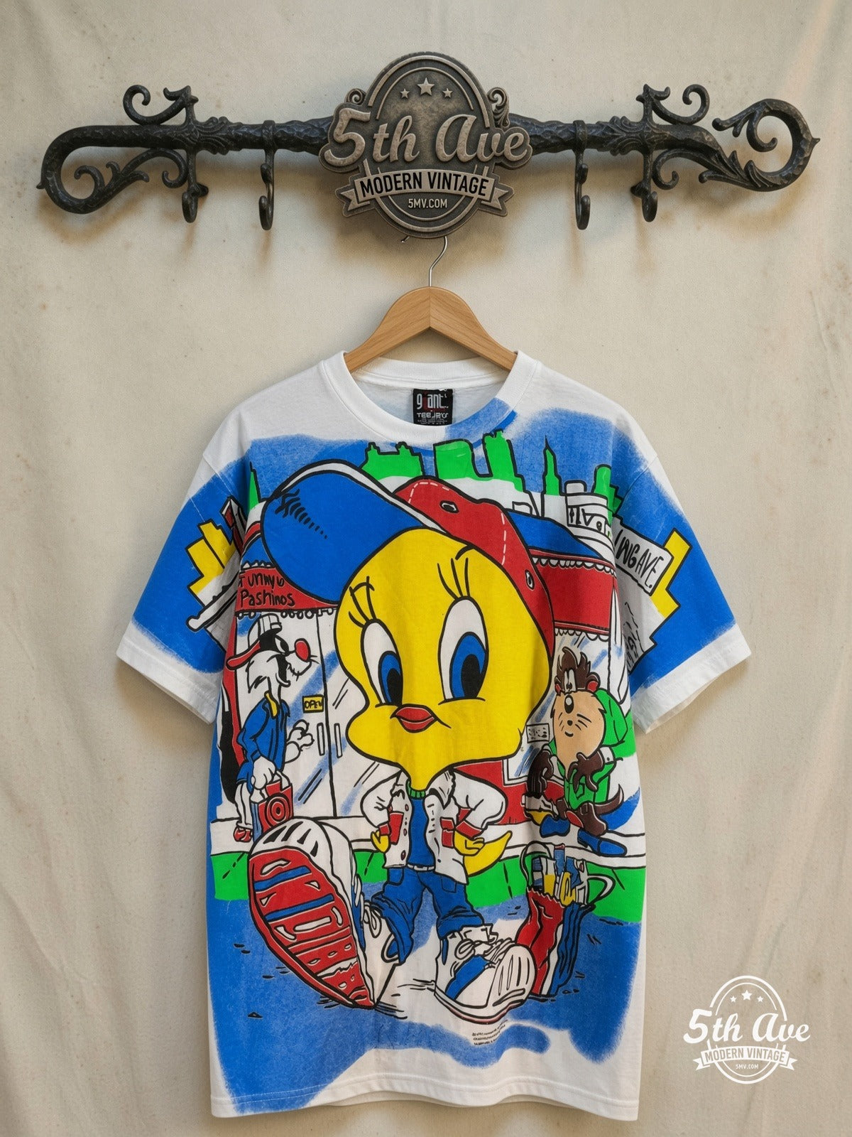 Looney Tunes – Tweety, Taz and Sylvester – All Over Print – New Vintage Graphic Tee — front on locked cream ornate 5th Ave rack