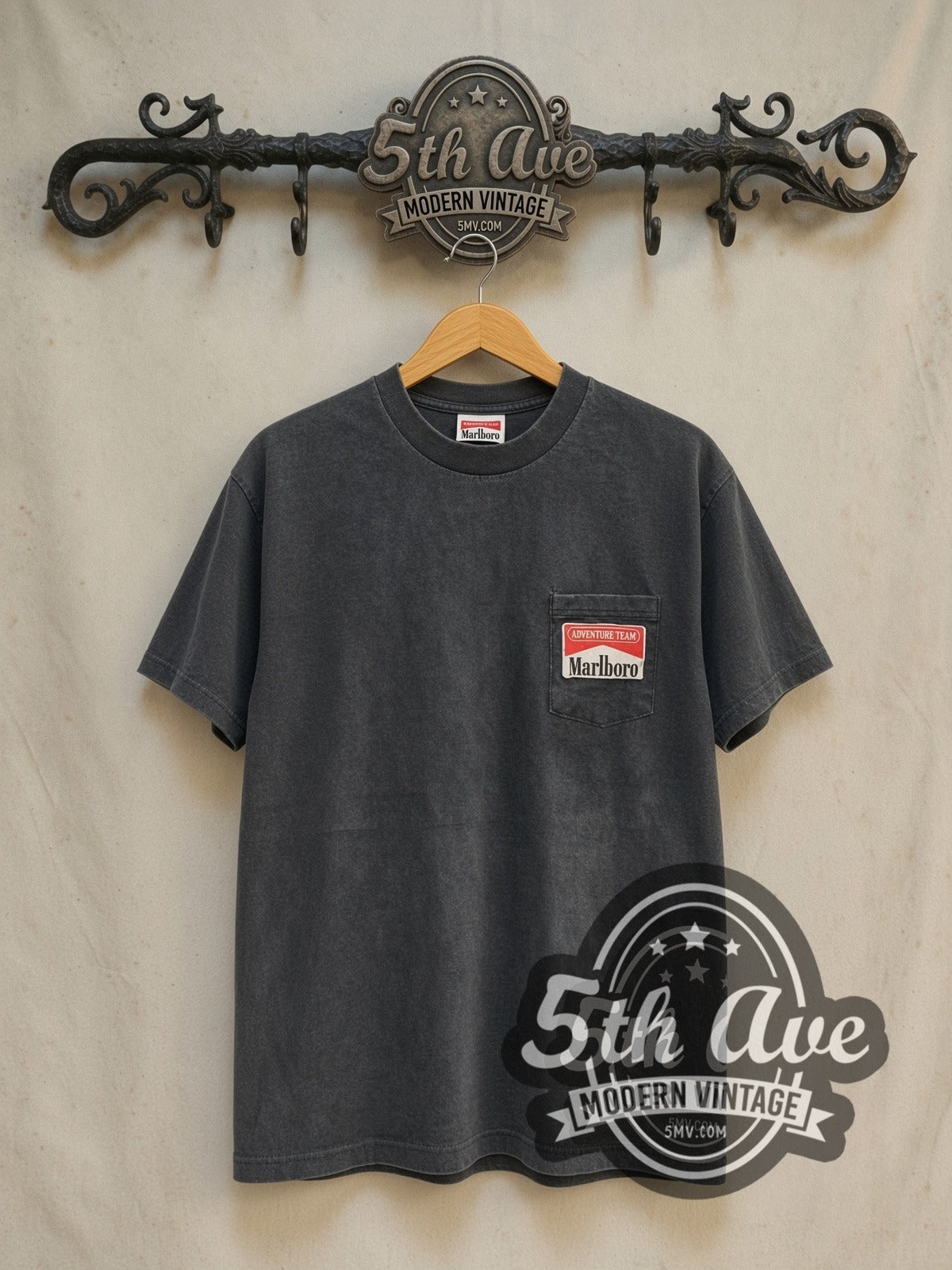 Marlboro Cowboy vintage graphic tee in black, front view on a display rack