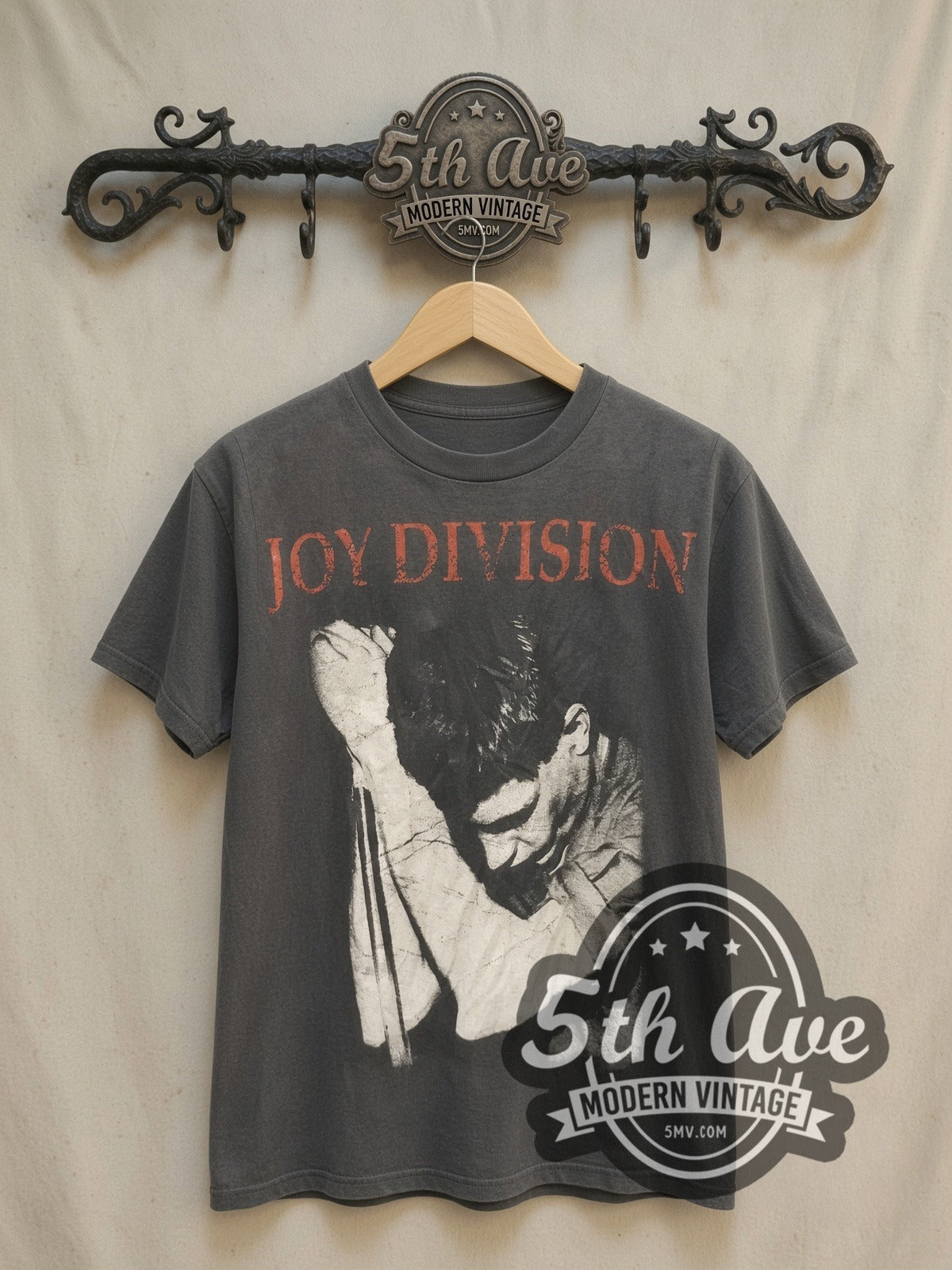 Joy Division Singer Microphone Portrait vintage band t-shirt, front view on a display rack
