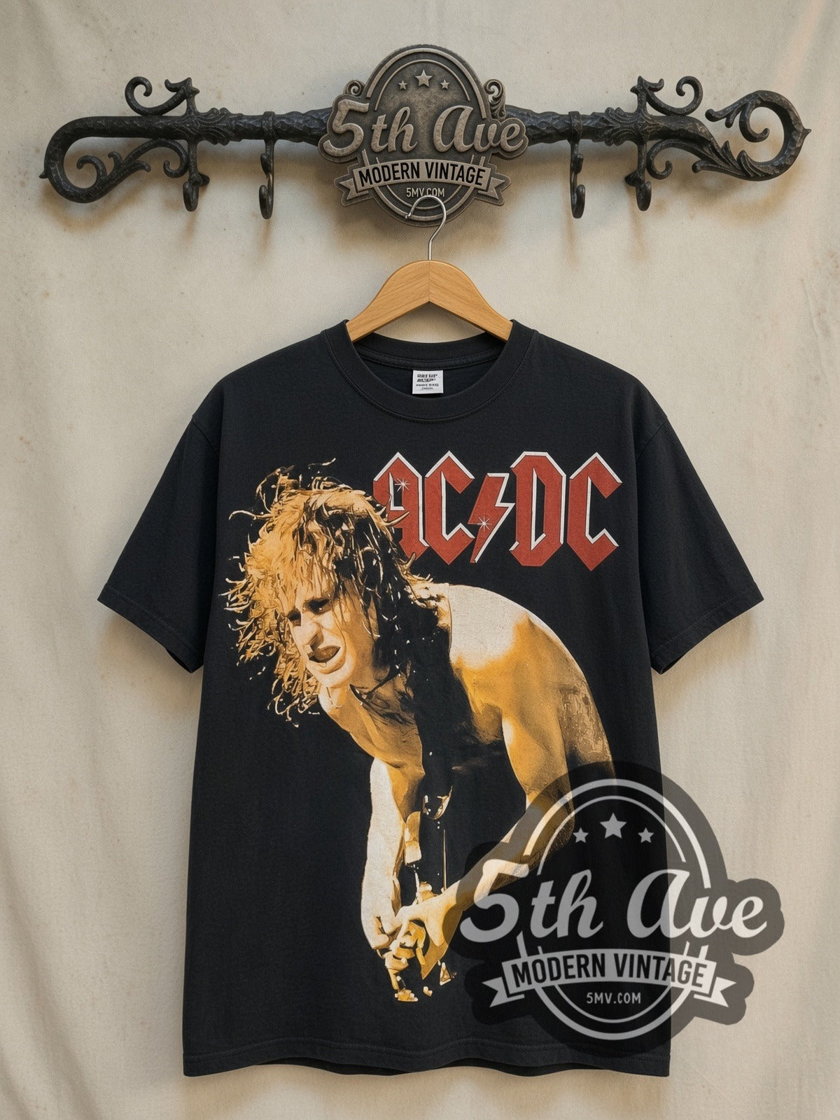 AC/DC Angus Young Guitar Solo all-over-print vintage band t-shirt in black, front view on a display rack