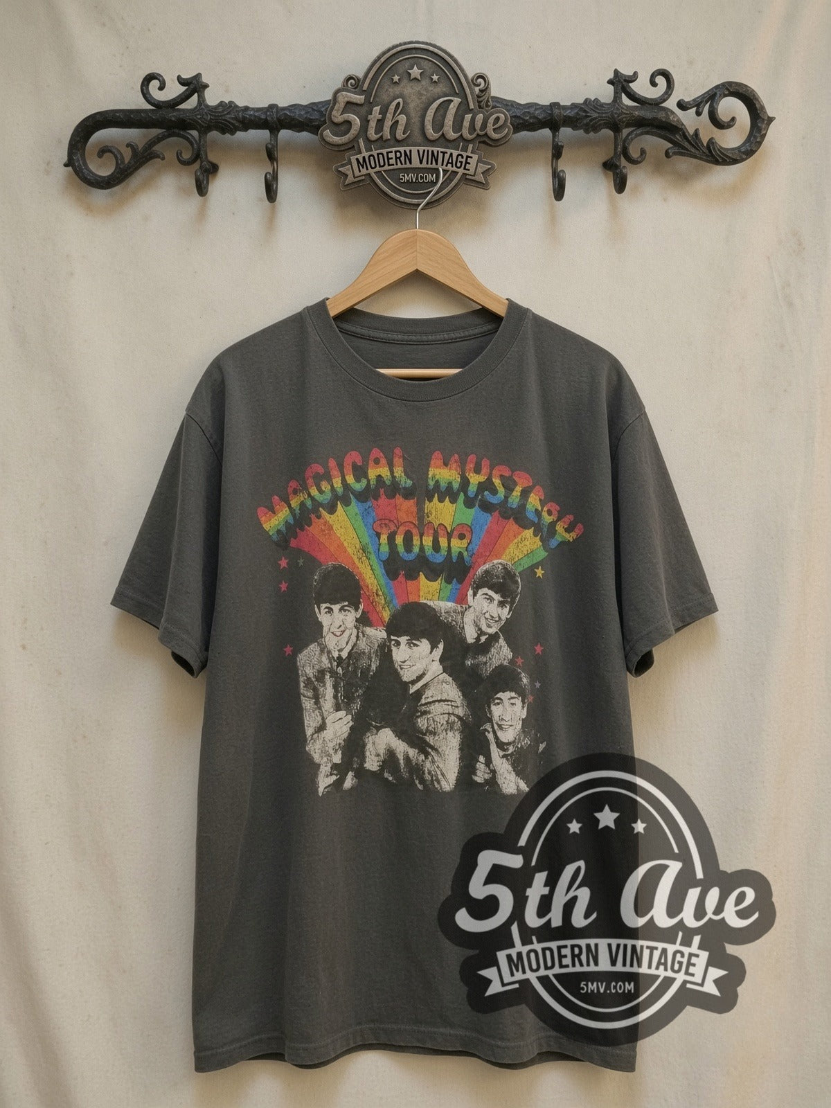 The Beatles Magical Mystery Tour Rainbow vintage band t-shirt, front view on a display rack