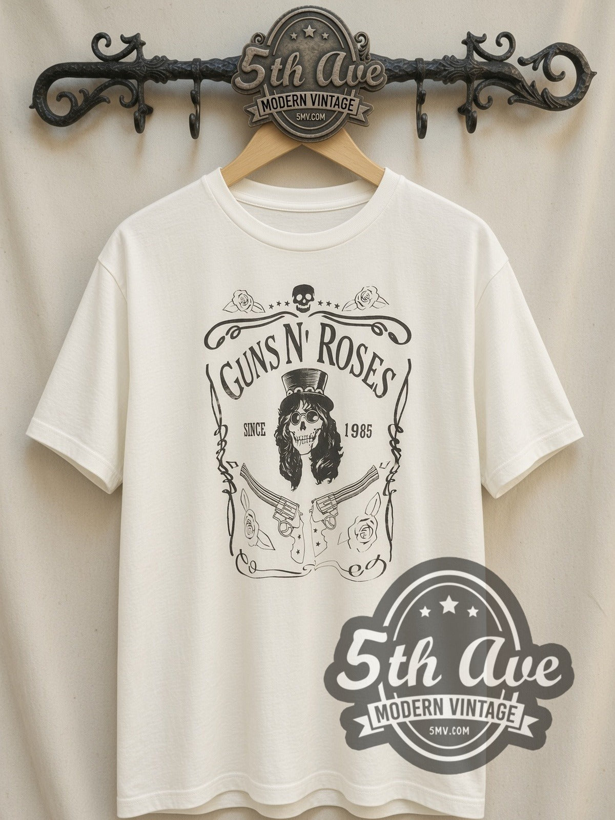 Guns N' Roses – Est. 1985 Skull Label (White) vintage band t-shirt, front view on a display rack
