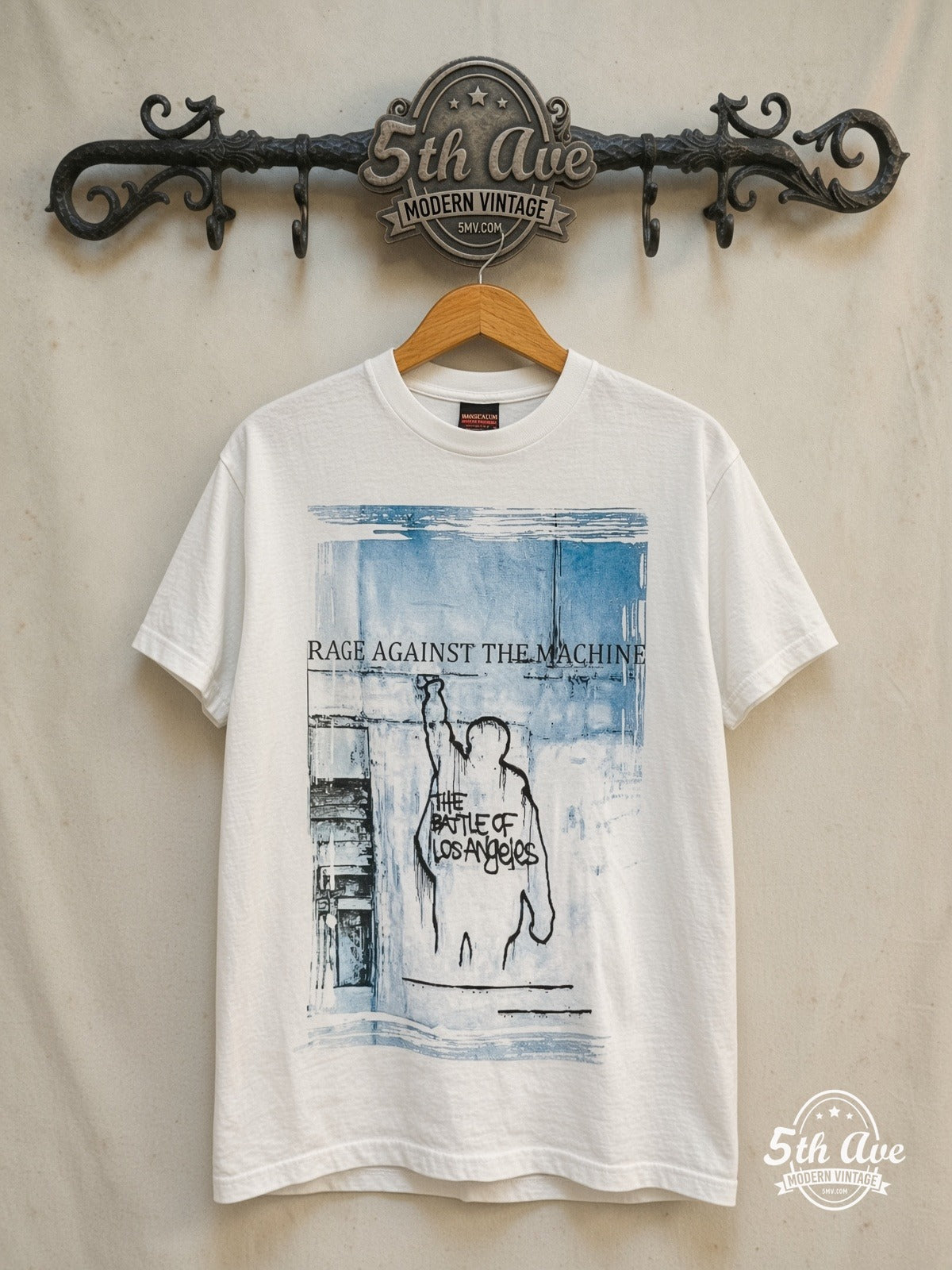 Rage Against the Machine – The Battle of Los Angeles Blue City List – Vintage Band T-Shirt — front on locked cream ornate 5th Ave rack