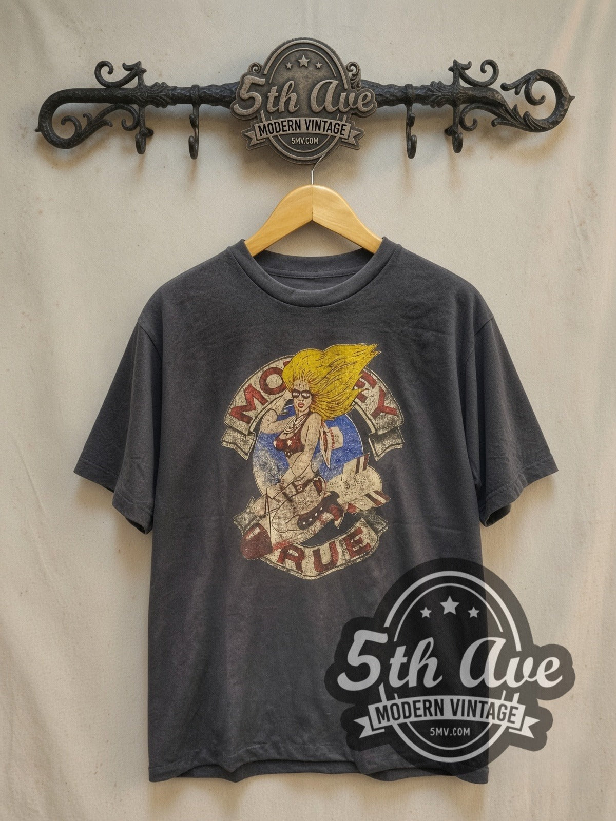 Mötley Crüe Girls Girls Girls Tour '87 vintage band t-shirt, front view on a display rack