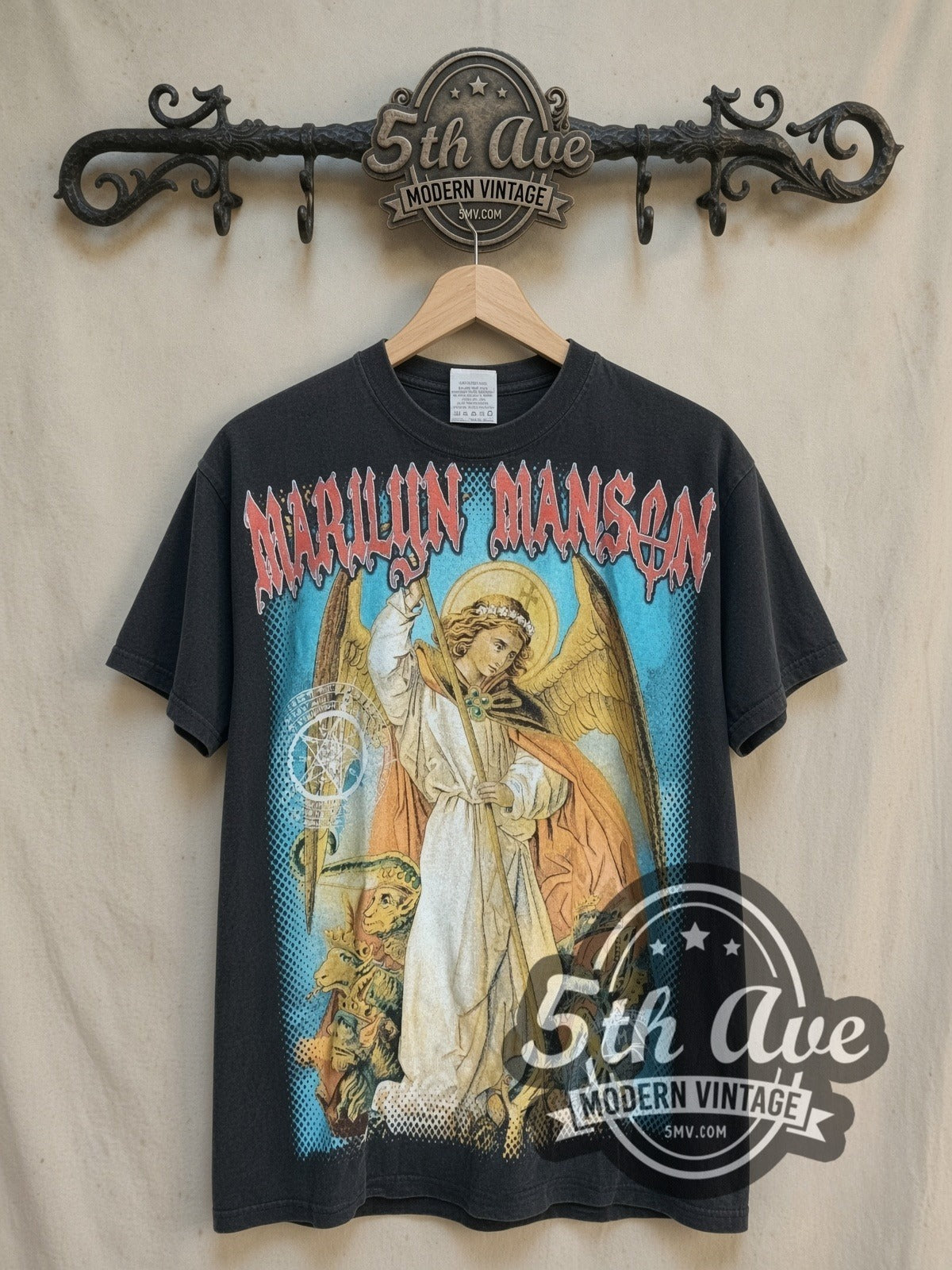 Marilyn Manson Angel Spear Demons Sigils vintage band t-shirt, front view on a display rack