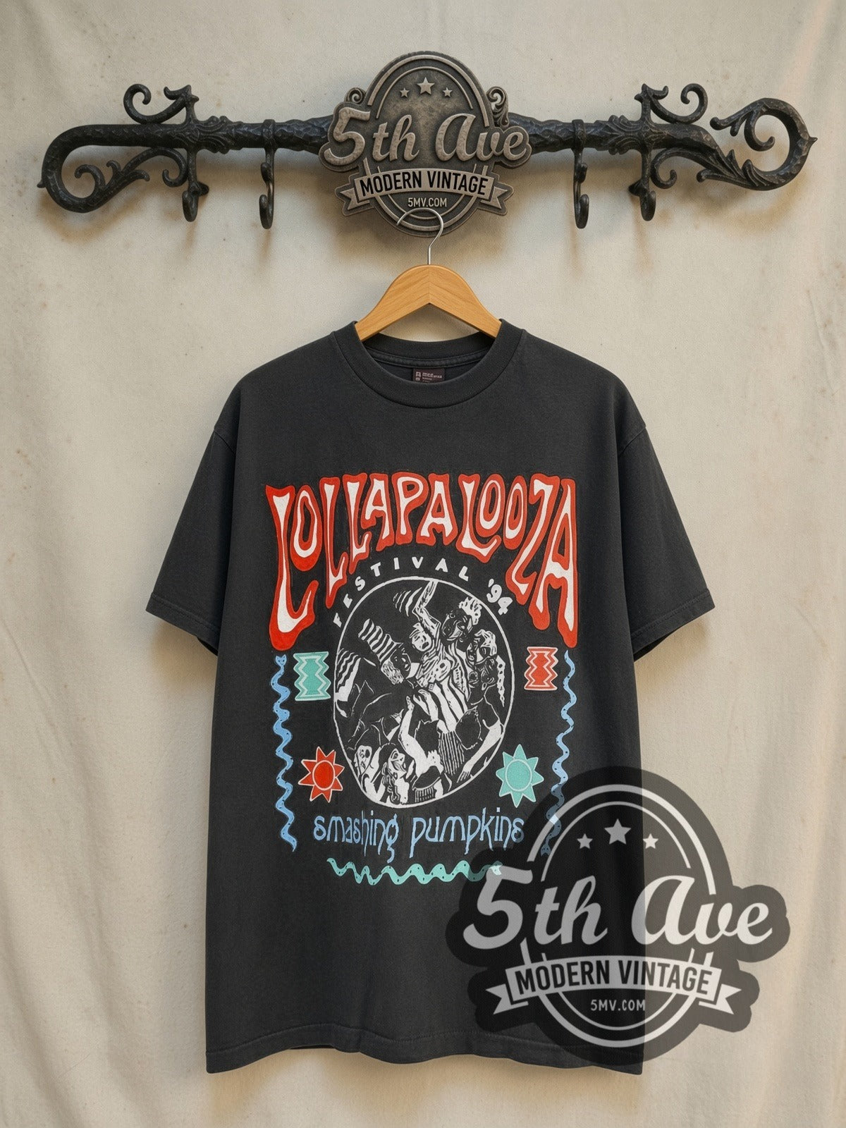 The Smashing Pumpkins Lollapalooza Tour 1994 vintage band t-shirt in black, front view on a display rack