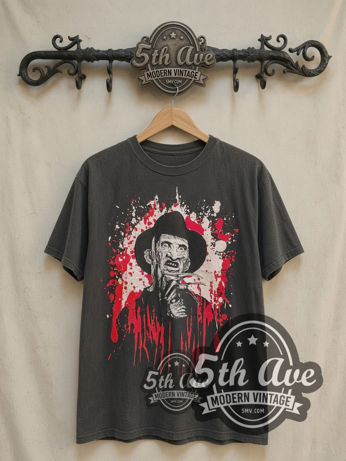 Freddy Krueger A Nightmare on Elm Street vintage graphic t-shirt, front view on a display rack