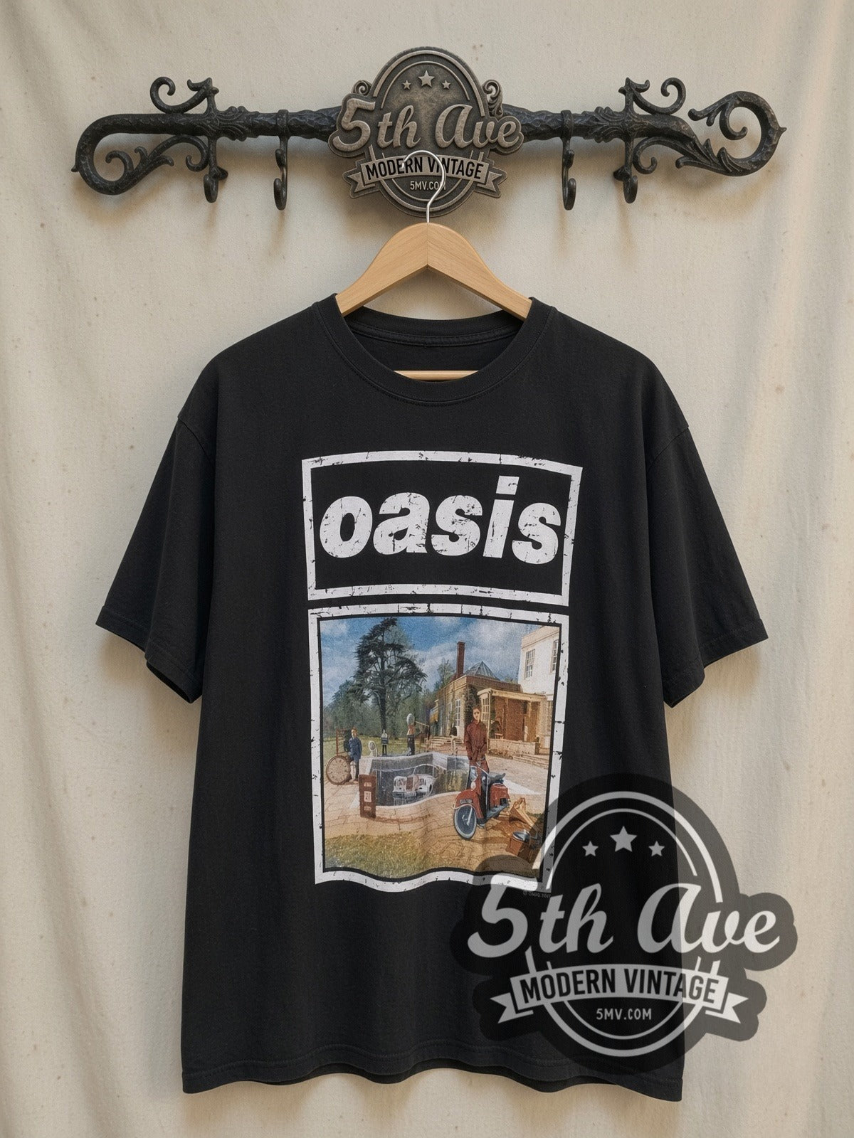 Oasis Be Here Now vintage band t-shirt, front view on a display rack