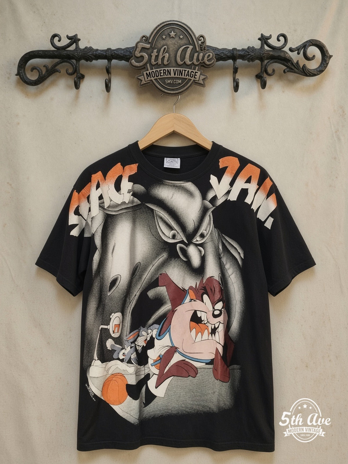 Looney Tunes – Space Jam – All Over Print – New Vintage Graphic Tee — front on locked cream ornate 5th Ave rack