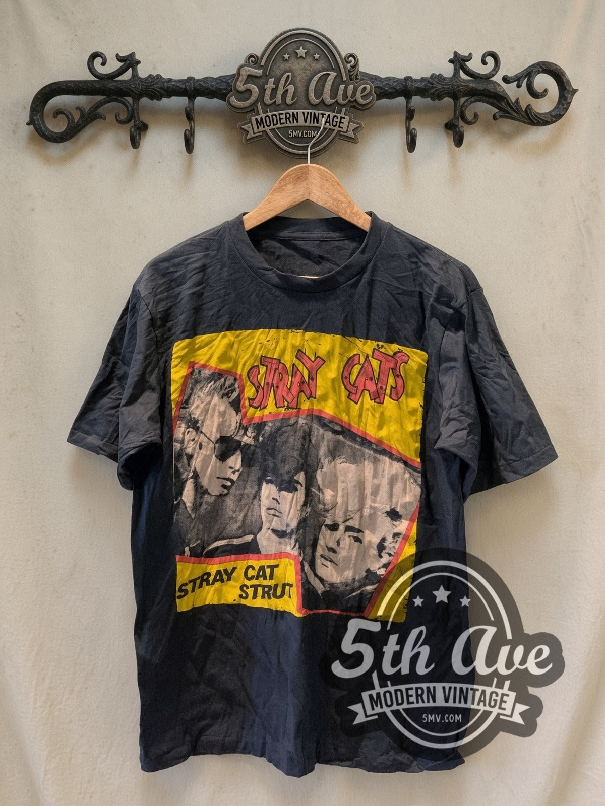 Stray Cats Stray Cat Strut Yellow Band Photo vintage band t-shirt, front view on a display rack