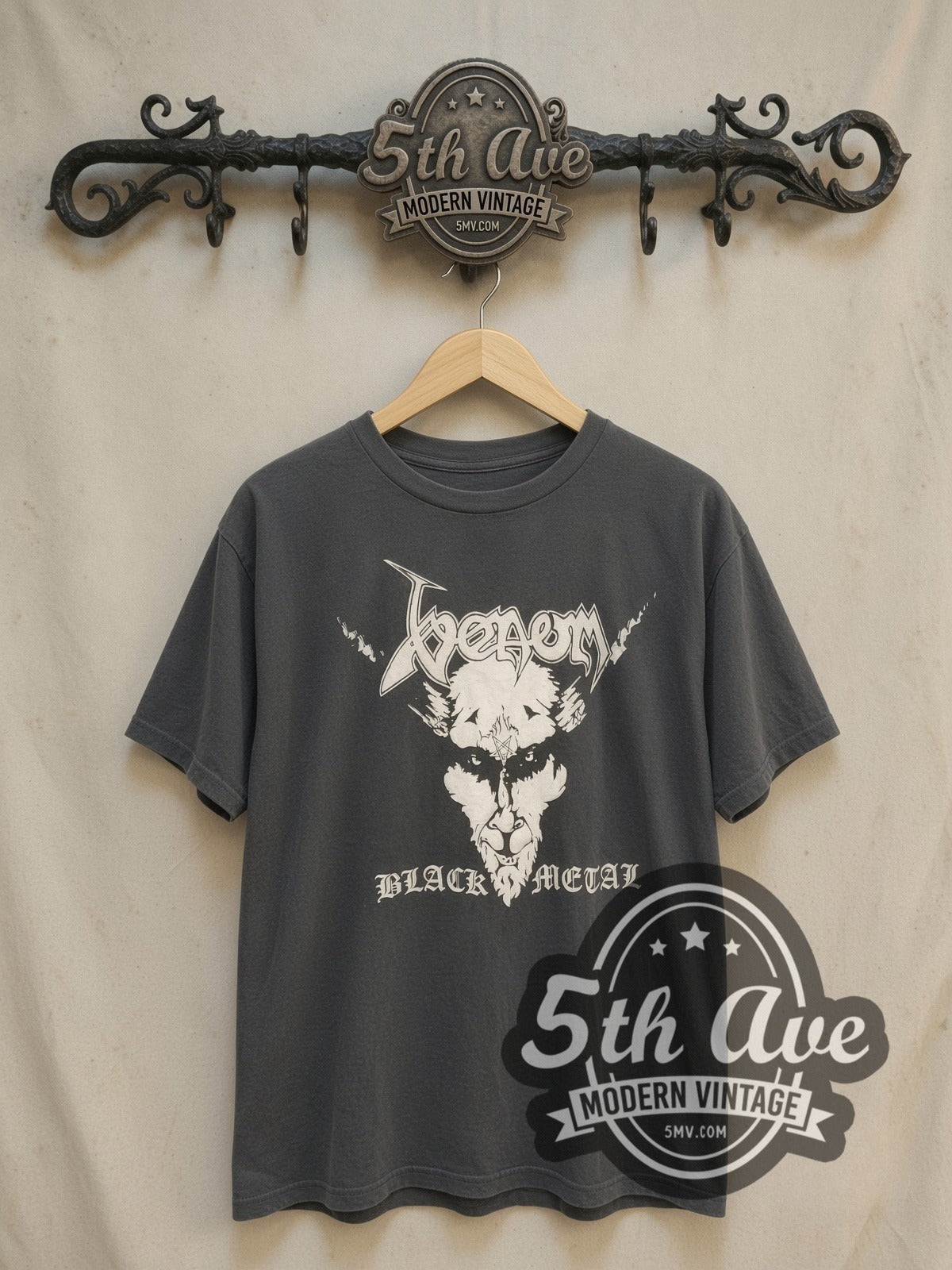 Venom vintage band t-shirt, front view on a display rack
