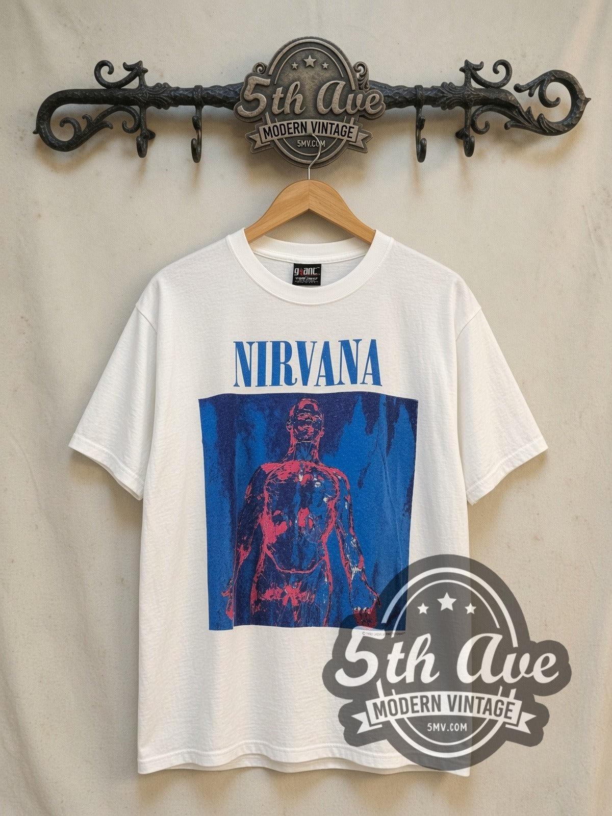 Nirvana Sliver Blue Logo Anatomical Figure White vintage band t-shirt, front view on a display rack