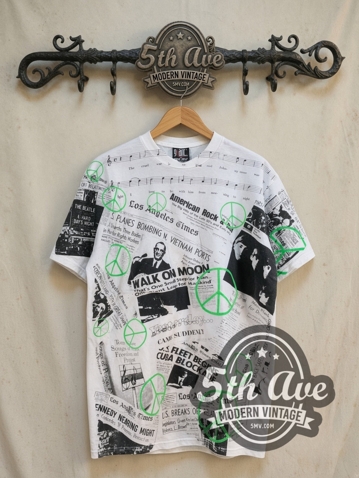 The Beatles Los Angeles Times all-over-print vintage band t-shirt, front view on a display rack