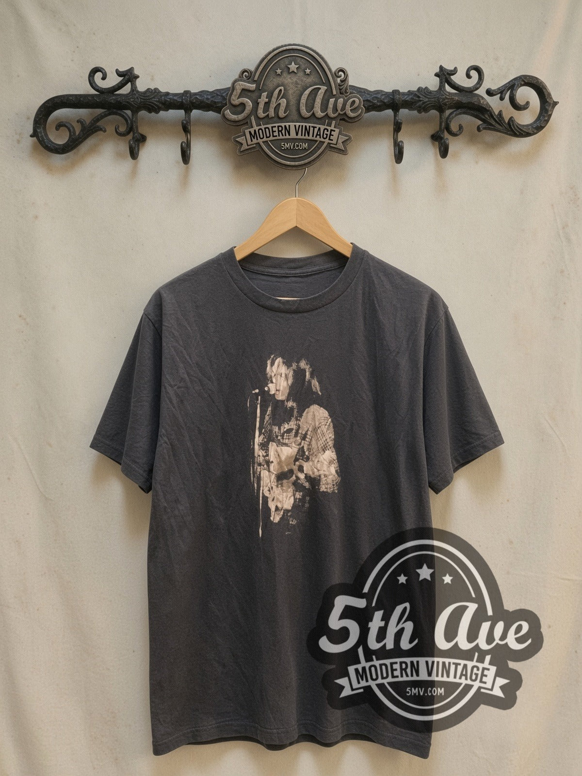 Neil Young Black-and-White Performance with Captain Boot Tag vintage band t-shirt, front view on a display rack