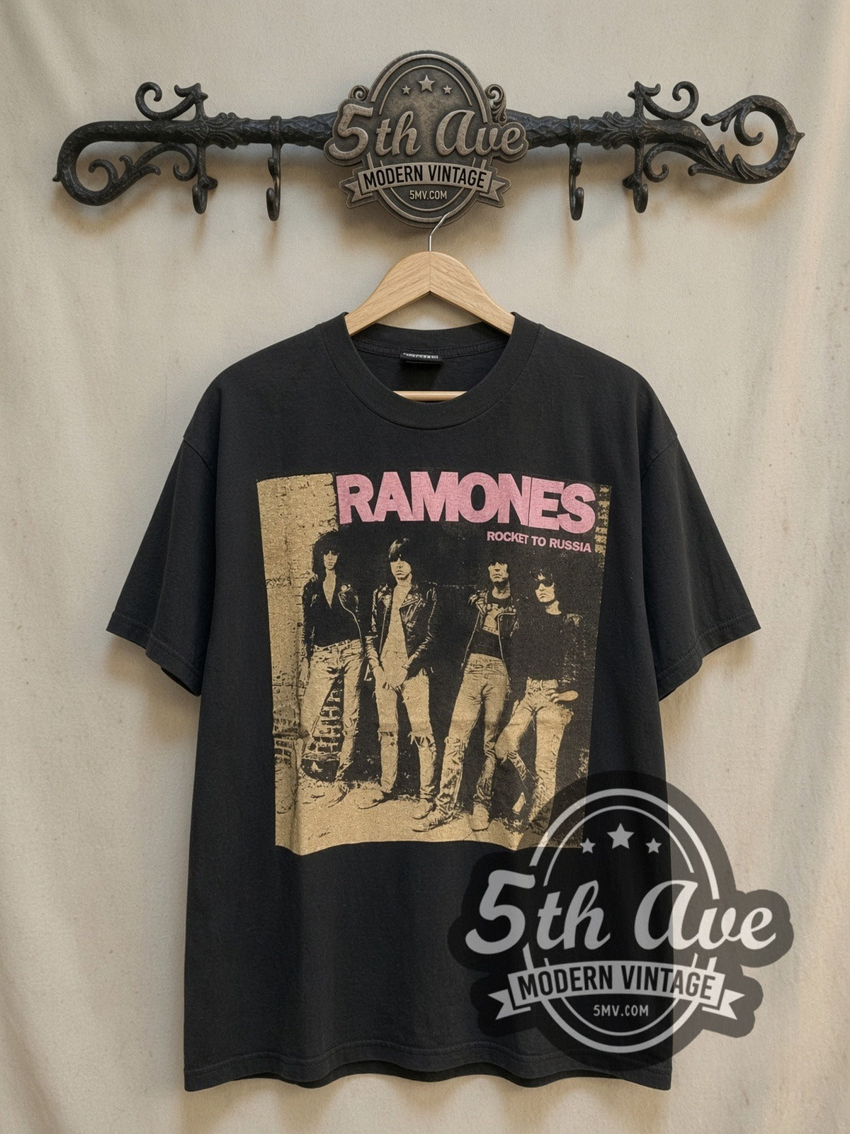 The Ramones Live at the CBGB's 1977 vintage band t-shirt, front view on a display rack