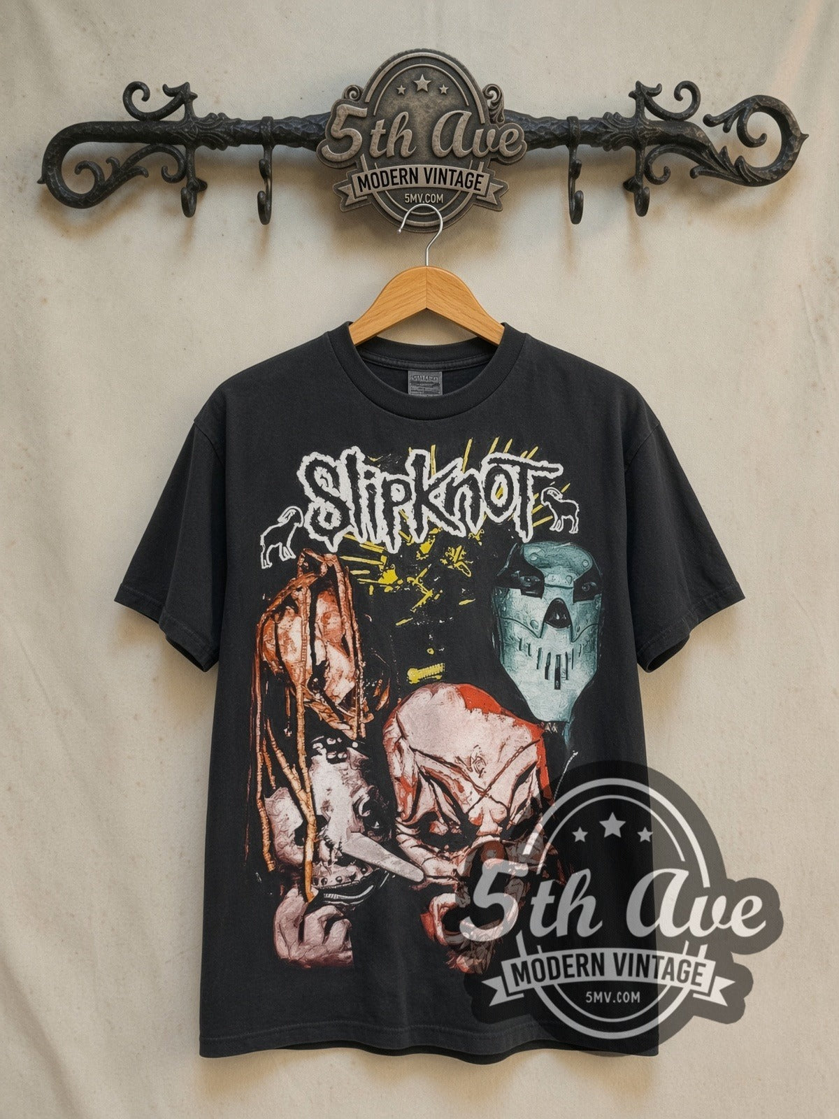 Slipknot Iowa Masks vintage band t-shirt in black, front view on a display rack