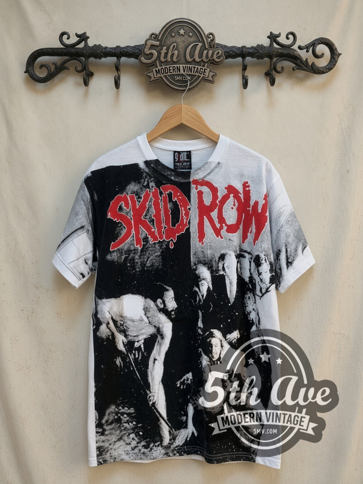 Skid Row Slave to the Grind all-over-print vintage band t-shirt in white, front view on a display rack