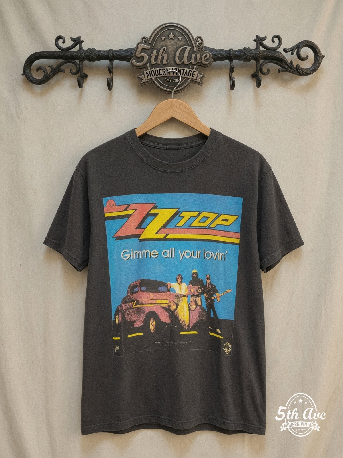 ZZ Top – Gimme All Your Lovin' – Vintage Band T-Shirt — front on locked cream ornate 5th Ave rack