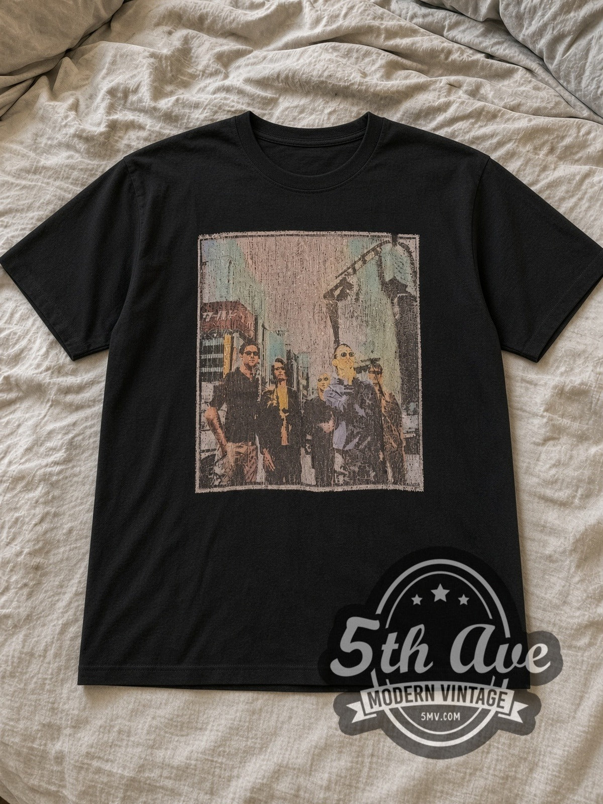 Black Radiohead Distressed Urban Band Photo Charcoal Vintage Band T-Shirt laid flat on a linen bed