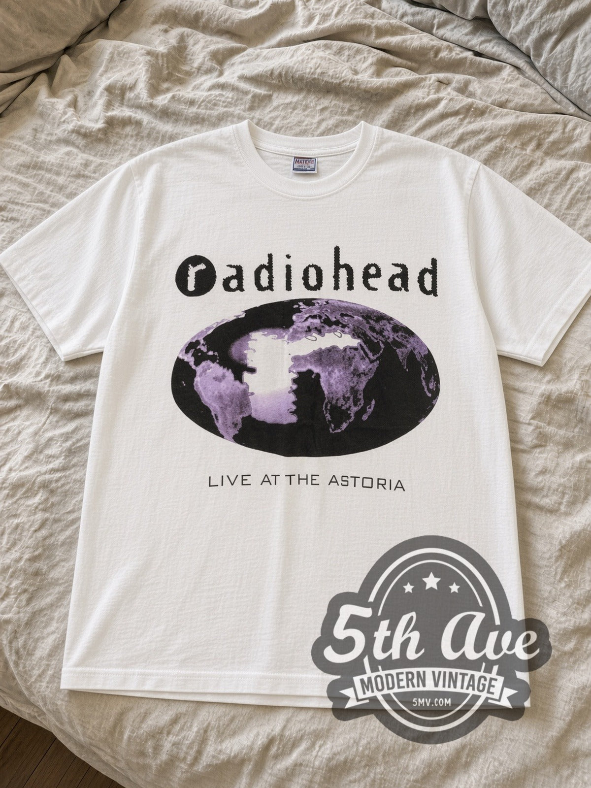 White Radiohead Live at the Astoria tee laid flat on linen bed