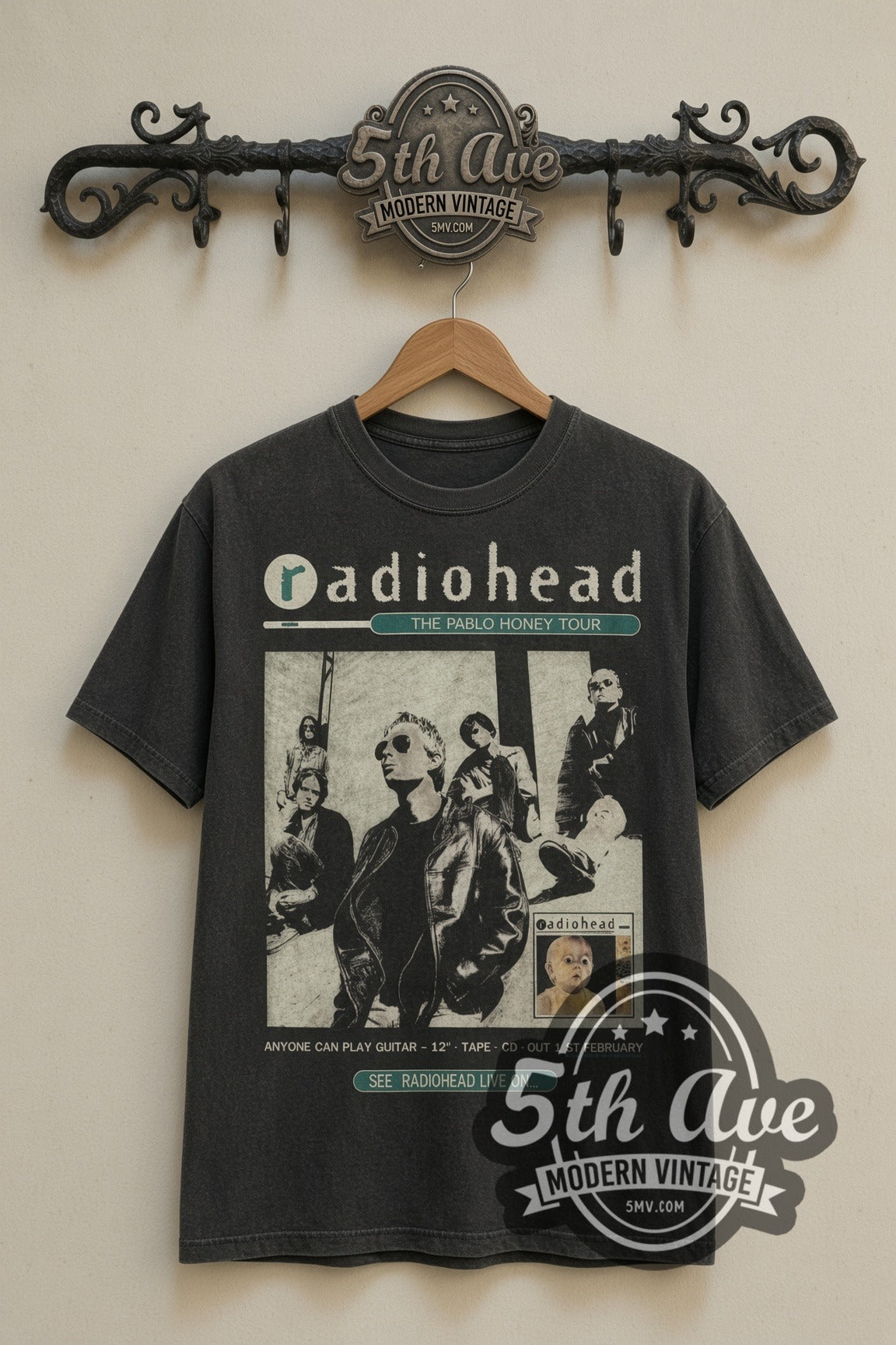 Radiohead Pablo Honey Bear Logo vintage band t-shirt in black, front view on a display rack
