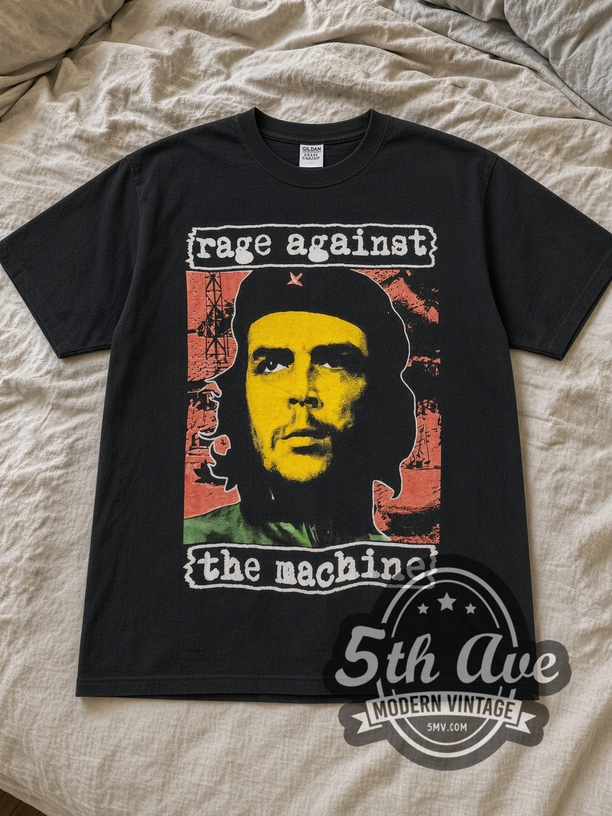 Black Rage Against the Machine Bombtrack Vintage Band T-Shirt laid flat on a linen bed