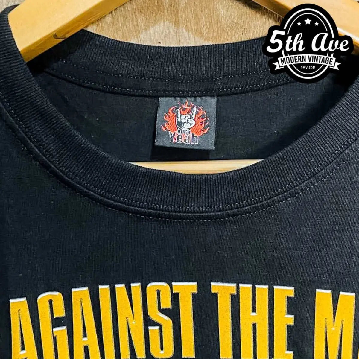 Model wearing Rage Against the Machine – Evil Empire Boy Yellow Logo vintage band tee