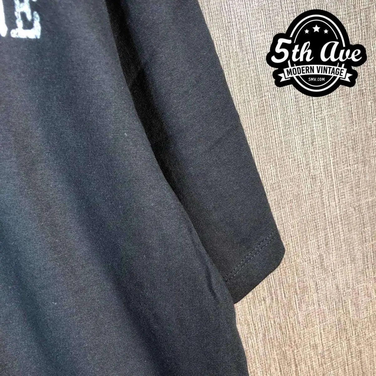 Model wearing Rage Against the Machine – The Battle of Los Angeles White Fist Silhouette vintage band tee