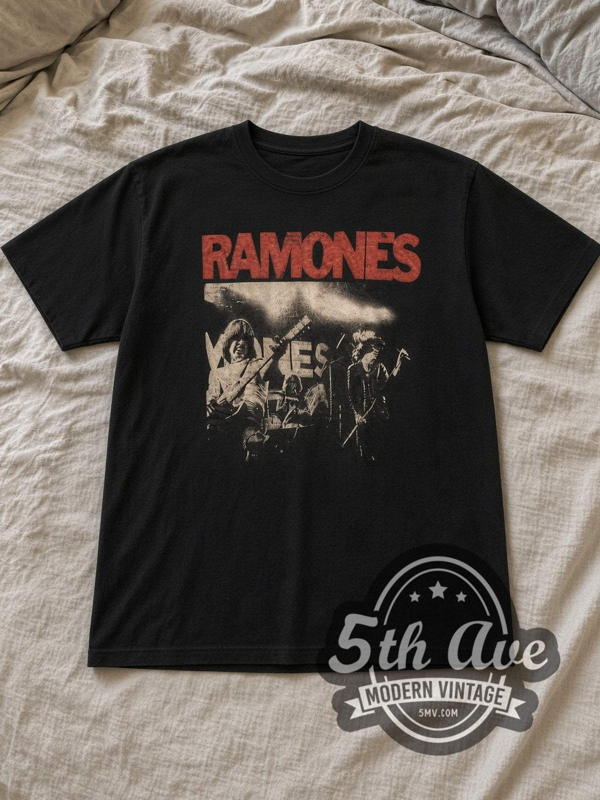Black Ramones Live Stage Shot Red Logo Vintage Band T-Shirt laid flat on a linen bed