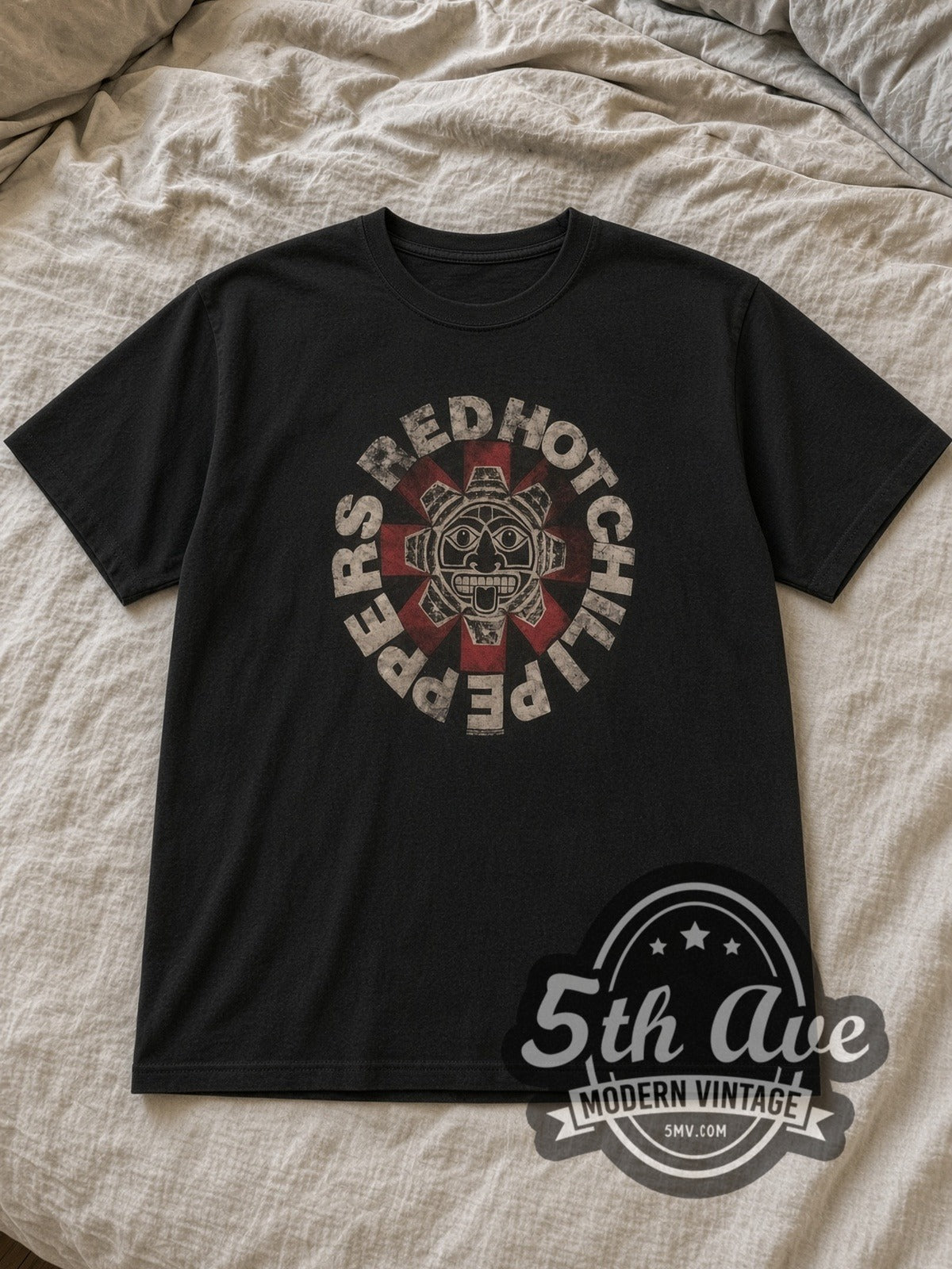 Black Red Hot Chili Peppers Aztec Sun Face Asterisk Black Vintage Band T-Shirt laid flat on a linen bed