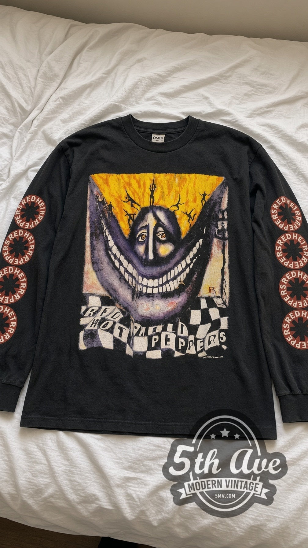 Red Hot Chili Peppers Purple Face Tour Long Sleeve vintage band t-shirt in black laid flat on a bed, front artwork