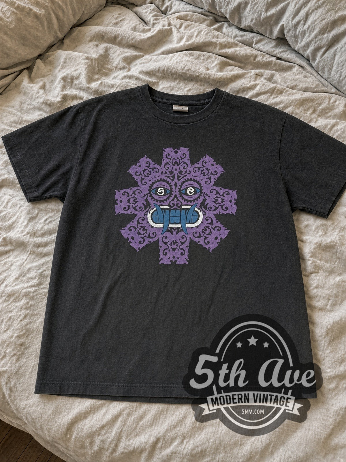 Faded black RHCP purple tribal face tee laid flat on linen bed