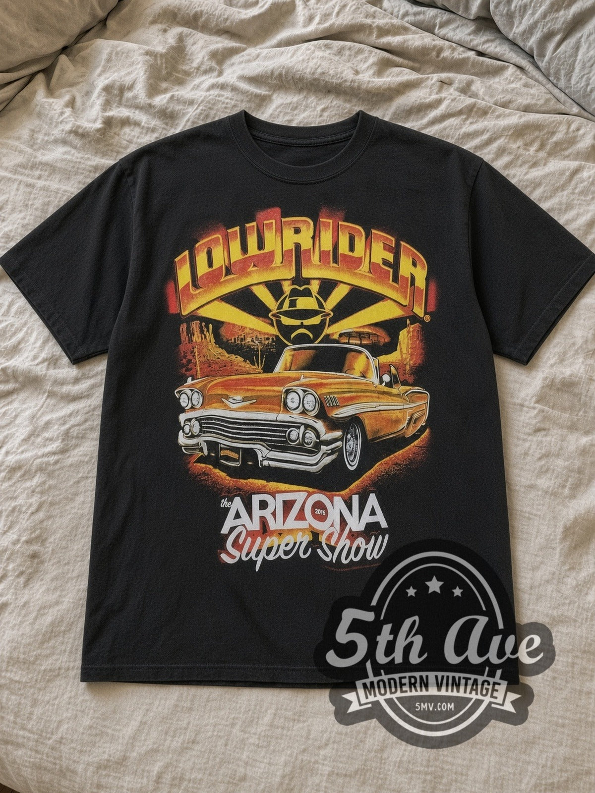 Black Rollin Hard The Arizona Super Show Vintage Graphic T-Shirt laid flat on a linen bed